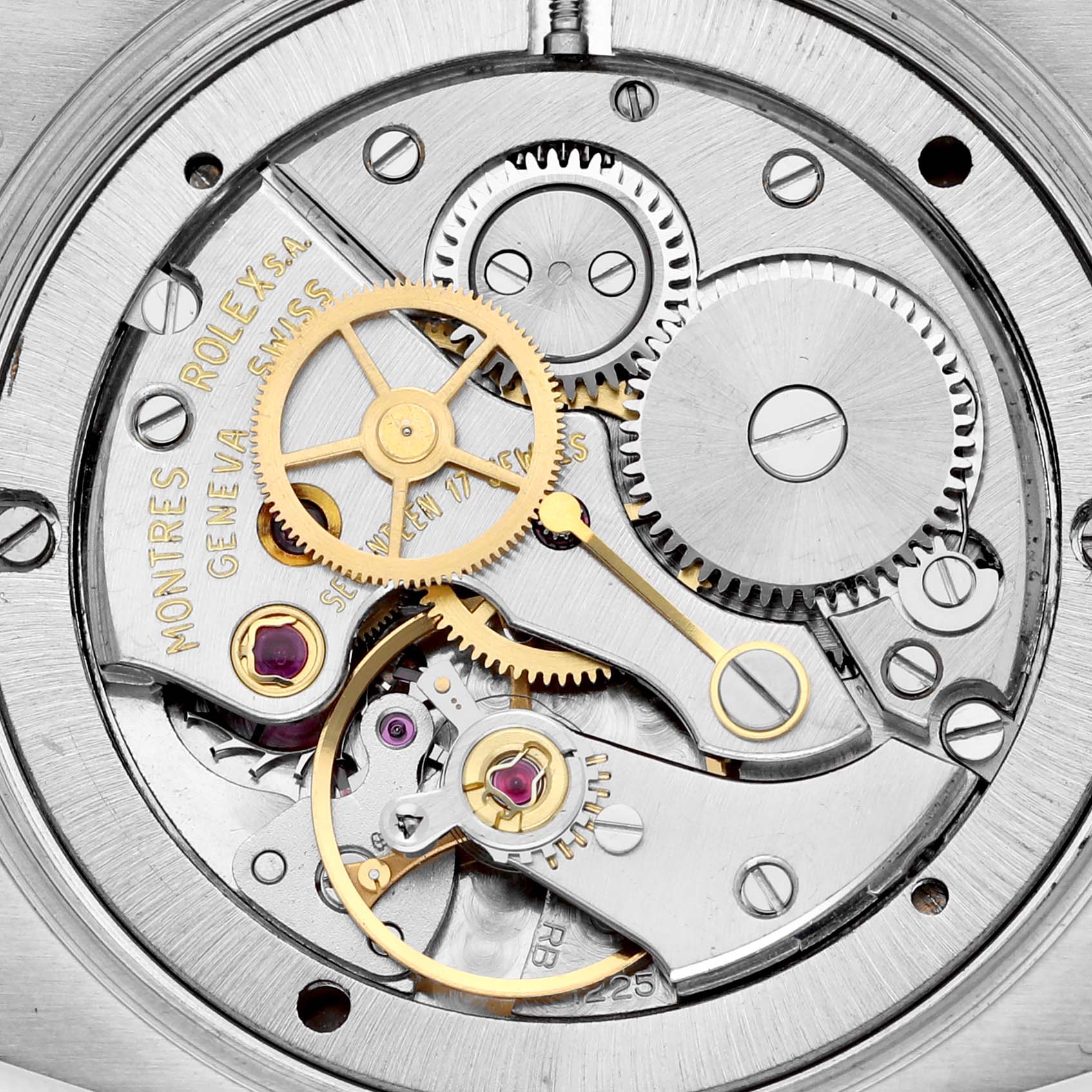 The image shows a close-up view of the intricate inner mechanics of a Vintage Collection model by Rolex.