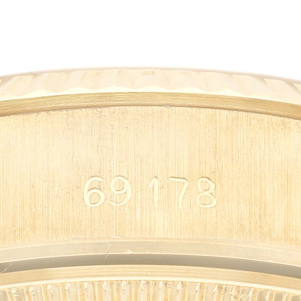 This close-up shows the side of a Rolex Datejust, model number 69178, highlighting the engraved model number on the case.