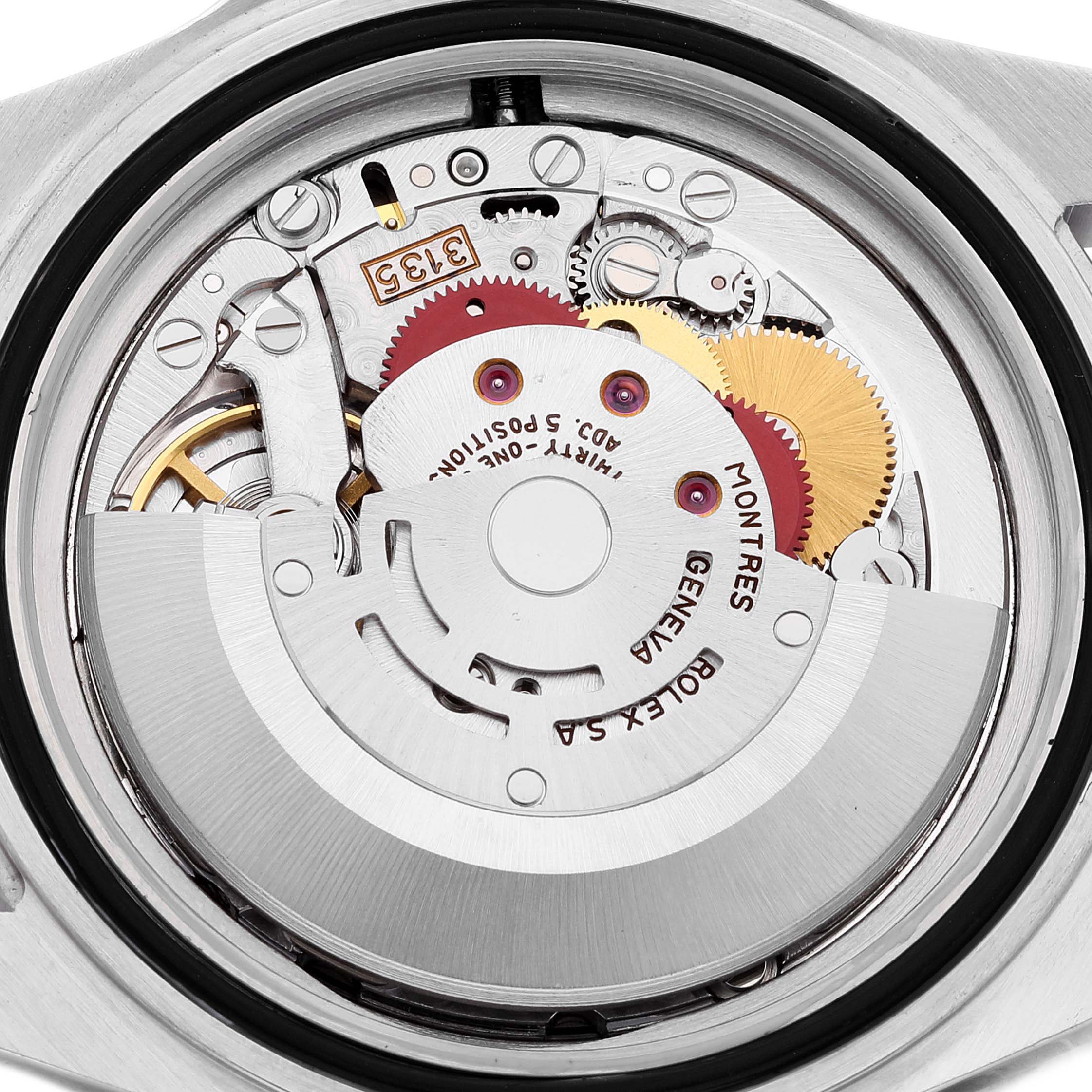 This image shows the internal mechanical movement of a Rolex Submariner 16610 Men
s Stainless Steel Black Dial 16610 Men
s Stainless Steel Black Dial watch from a back view, exposing the gears and rotor.