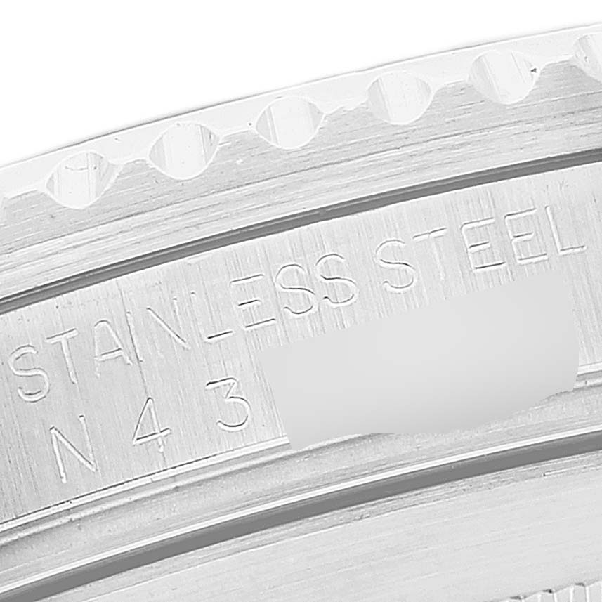 This is a close-up shot of the engraved bezel ring of a Rolex Submariner 16610 Men
s Stainless Steel Black Dial 16610 Men
s Stainless Steel Black Dial watch.