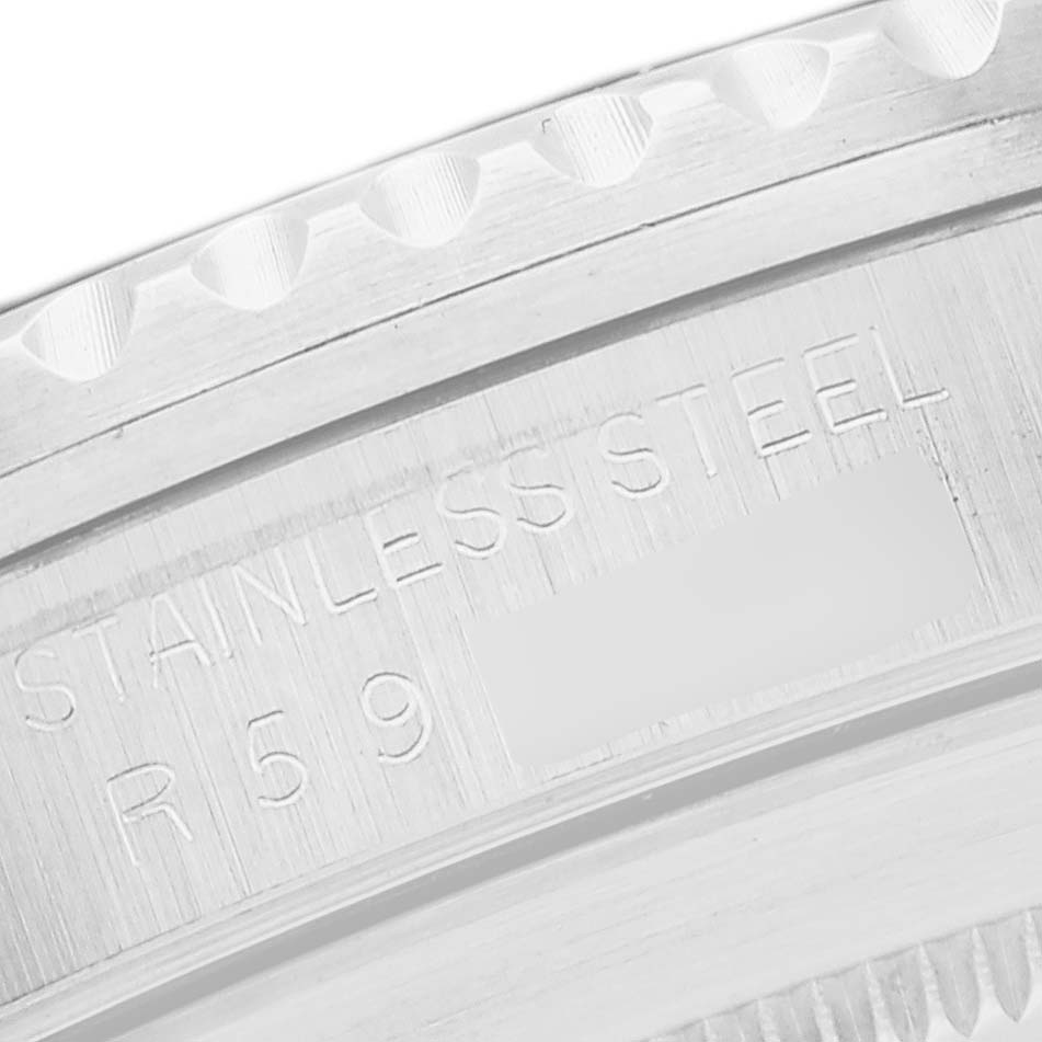 The image shows a close-up of the engraved stainless steel back case and bezel teeth of a Rolex Vintage Collection 168000 Men's Stainless Steel Black Dial 168000 Men's Stainless Steel Black Dial model watch.