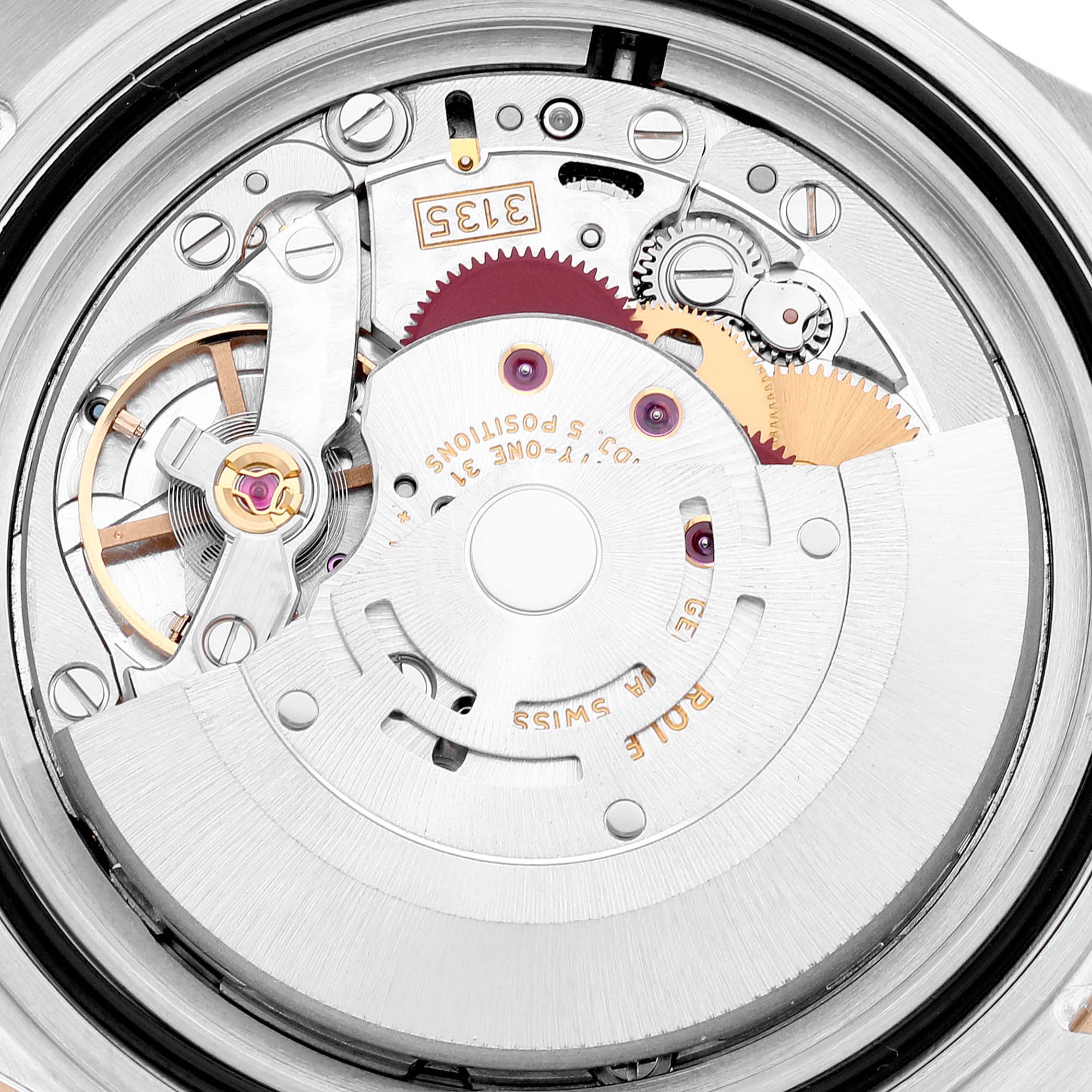 This image shows the intricate internal movement mechanism of a Rolex Submariner 16613 Men's Steel and Gold (two tone) Blue Dial 16613 Men's Steel and Gold (two tone) Blue Dial watch from a close-up angle.