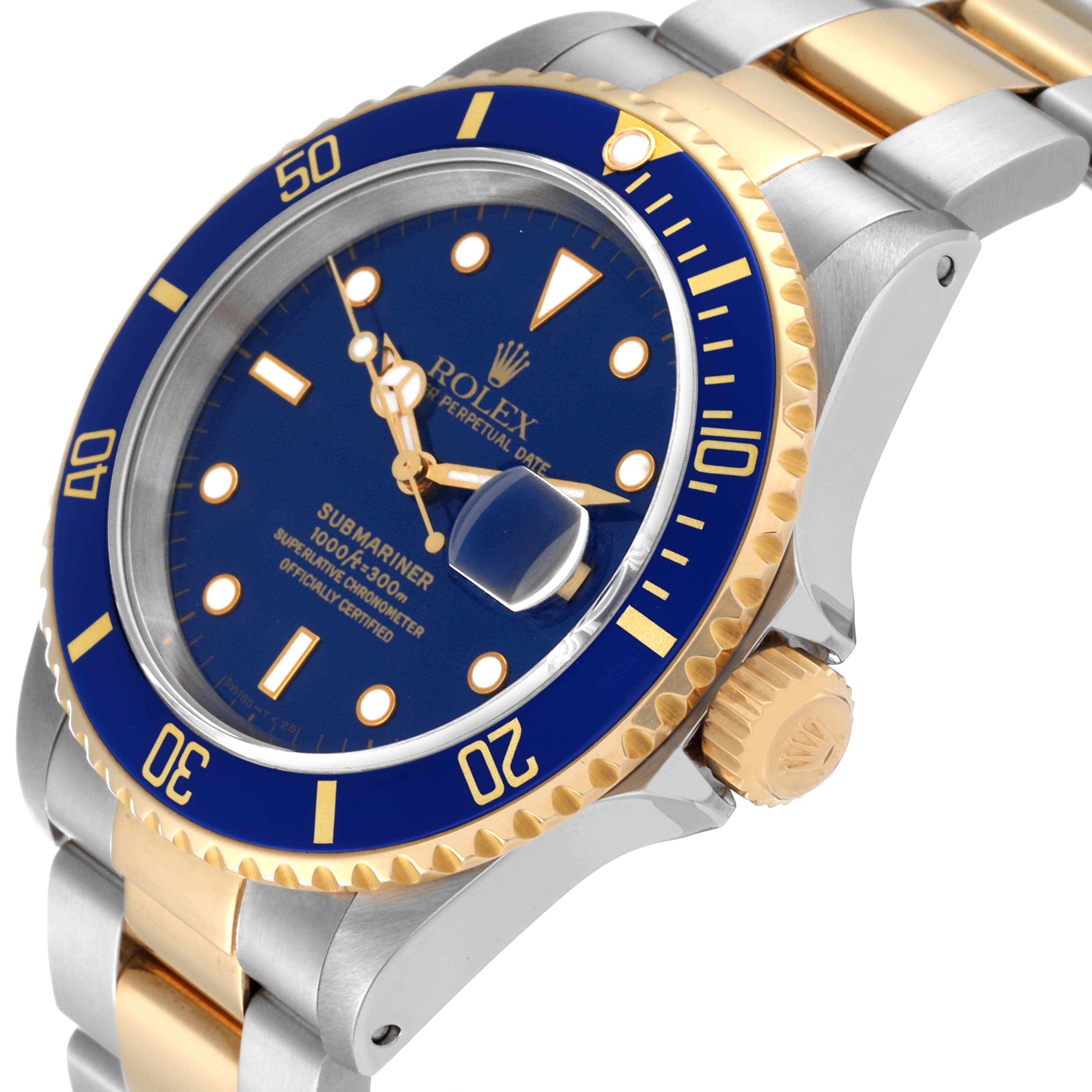 The image shows a close-up angle of a Rolex Submariner 16613 Men's Steel and Gold (two tone) Blue Dial 16613 Men's Steel and Gold (two tone) Blue Dial watch, featuring the bezel, crown, face, and part of the bracelet.