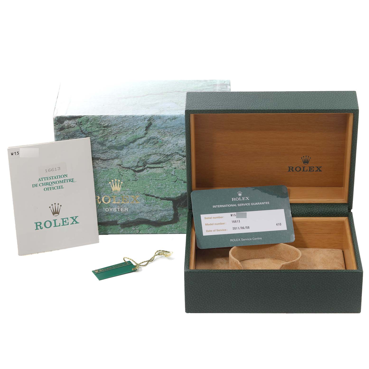 This image shows the accessories for a Rolex Submariner 16613 Men's Steel and Gold (two tone) Blue Dial 16613 Men's Steel and Gold (two tone) Blue Dial, including an open box, warranty card, booklet, and hang tag.