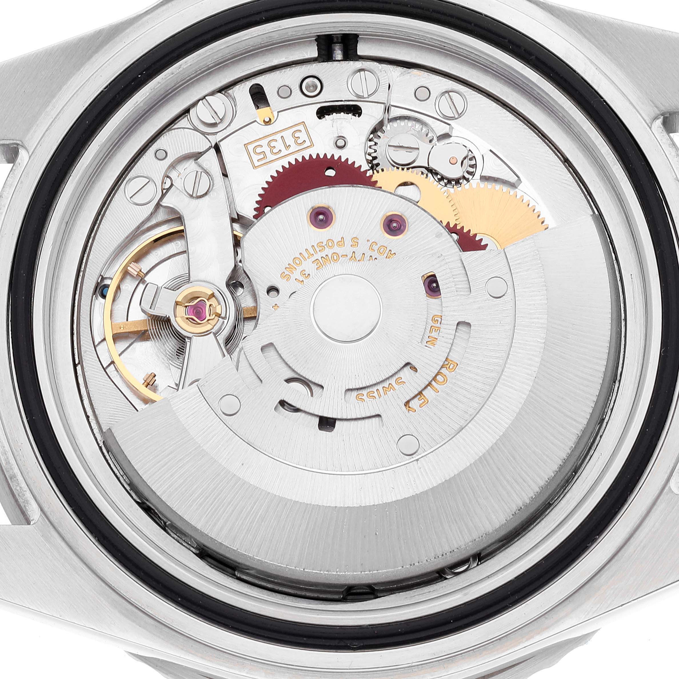 The image shows a close-up view of the movement inside a Rolex Submariner 16610 Men
s Stainless Steel Black Dial 16610 Men
s Stainless Steel Black Dial watch, displaying gears and mechanical parts.