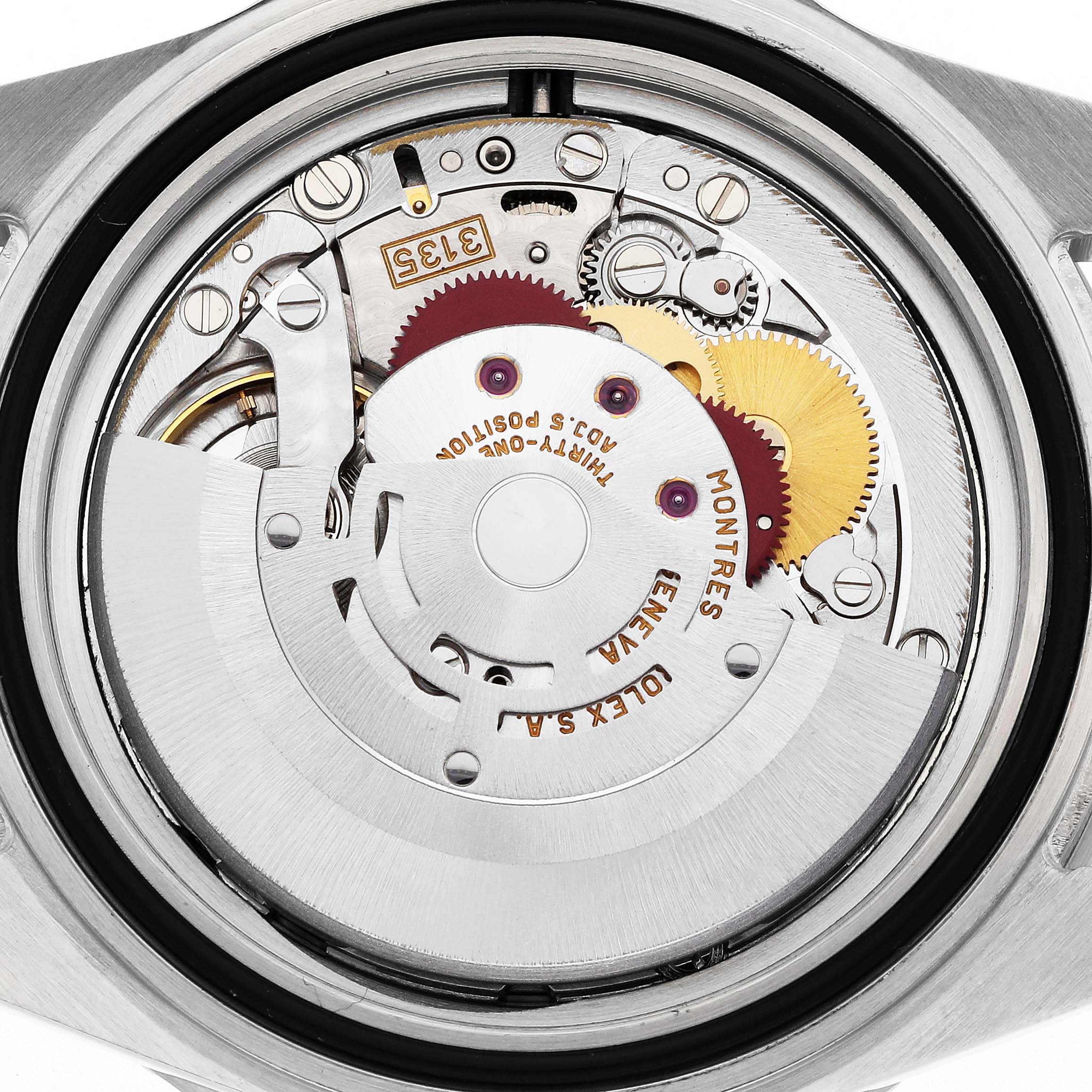 The image shows a close-up of the movement inside the Rolex Submariner model 16610, displaying gears and intricate details of the watch
s internal mechanism.