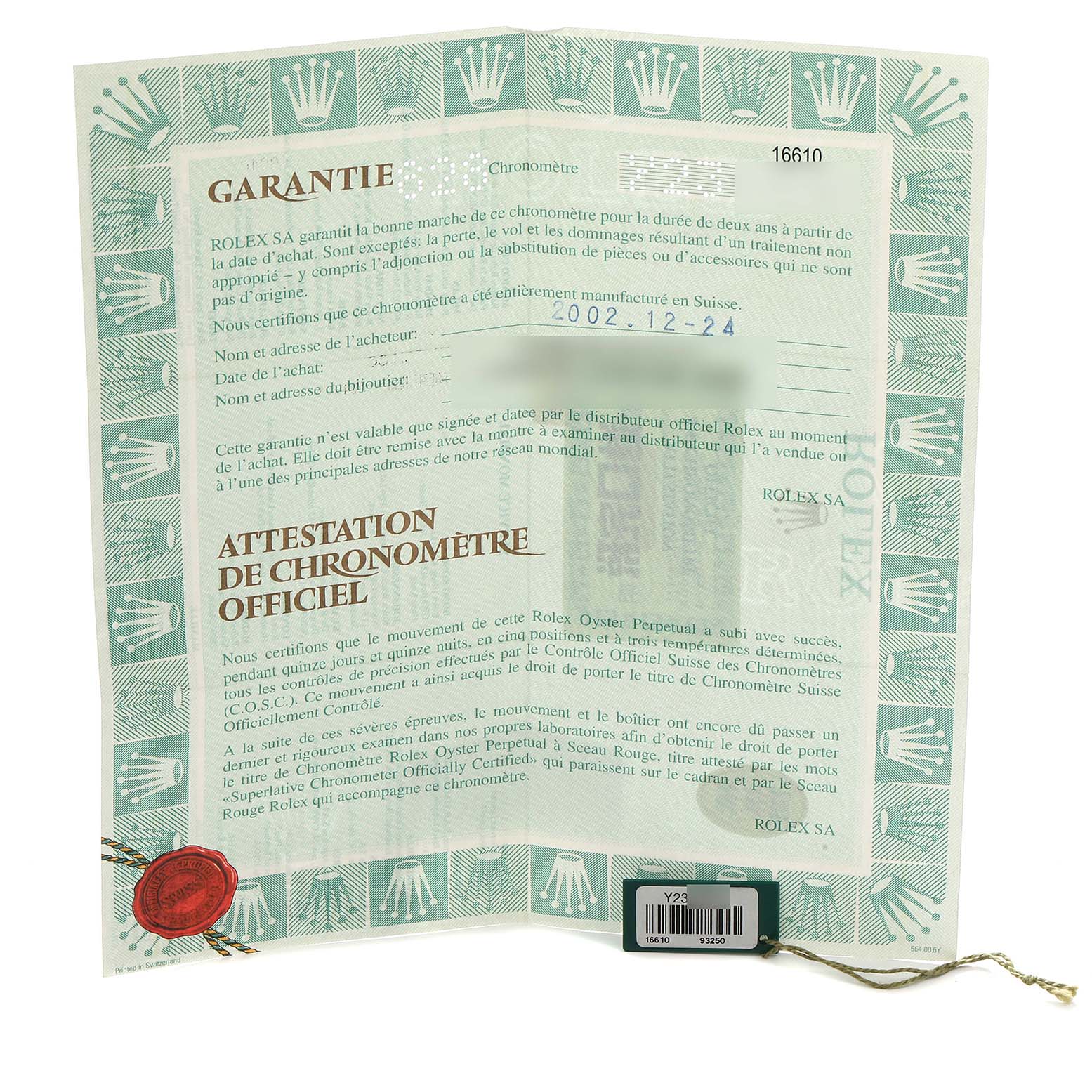 The image shows the warranty certificate for the Rolex Submariner, model 16610, with text detailing official chronometer certification.