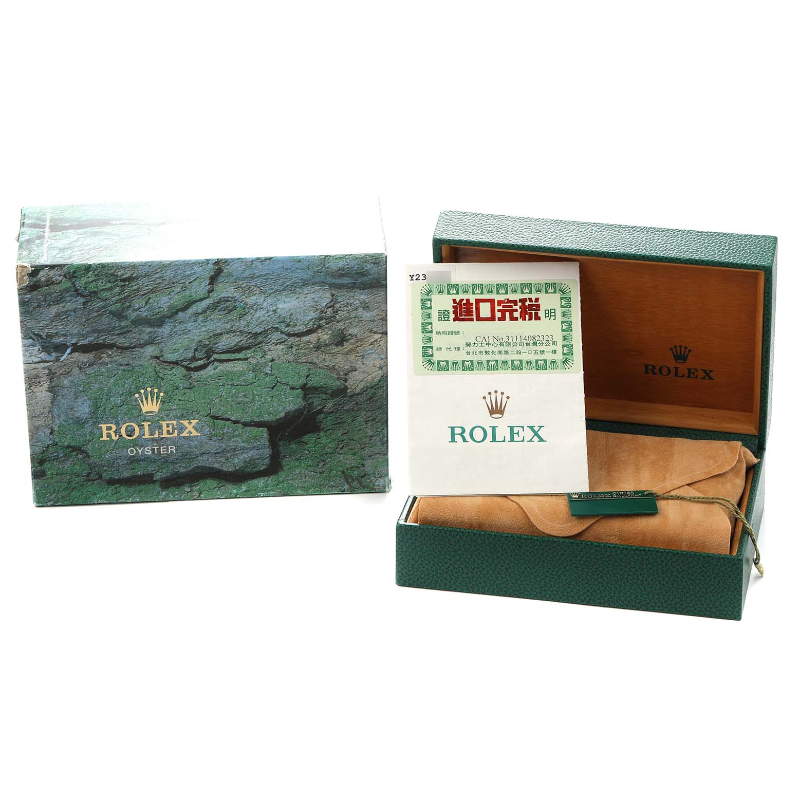 The image shows packaging for the Rolex Submariner model 16610 men
s watch, including the outer box, inner box with documents, and a suede pouch.