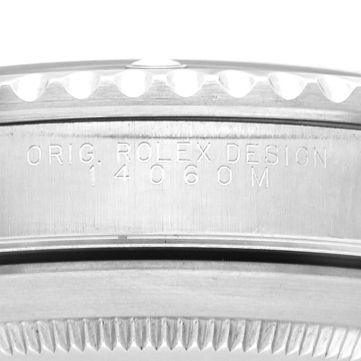 The image shows a close-up view of the case side and serial number engraving on a Rolex Submariner 14060 Men
s Stainless Steel Black Dial 14060 Men
s Stainless Steel Black Dial watch.