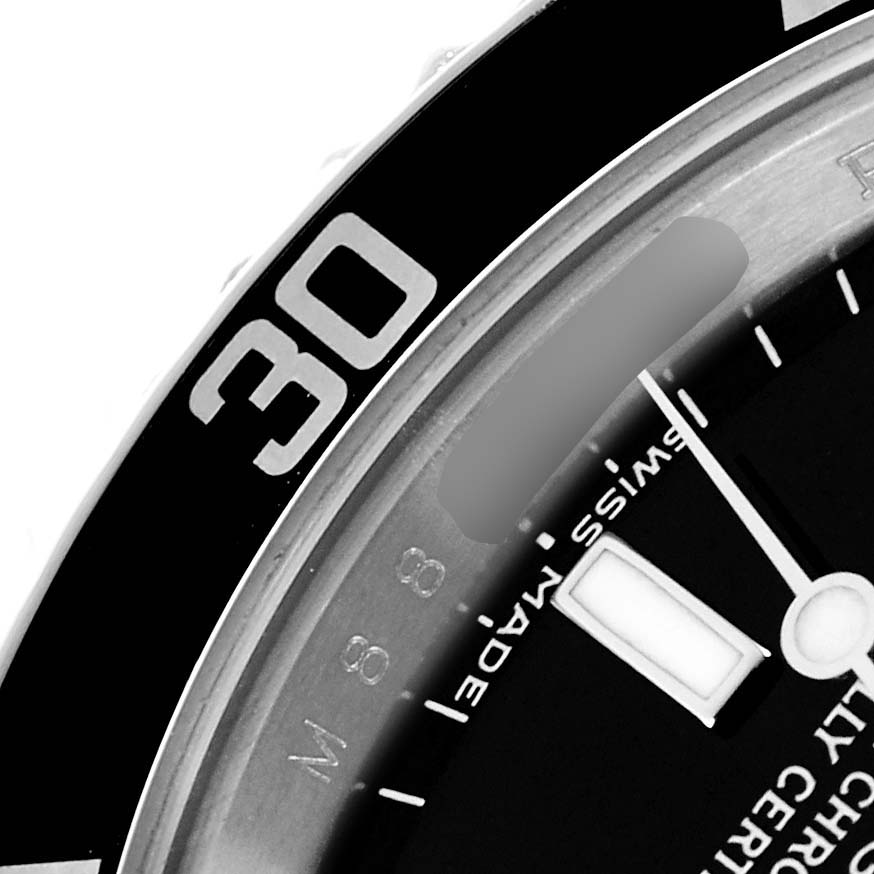 The image shows a close-up of the Rolex Submariner model 14060M men
s watch, featuring part of the bezel with the "30" mark and a portion of the dial.