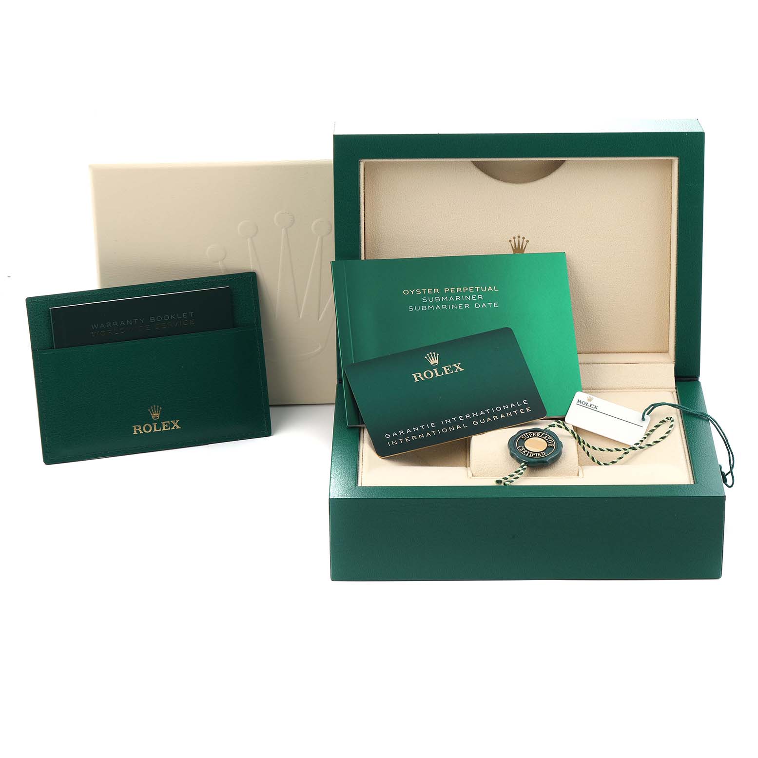 The image shows accessories for a Rolex Submariner model 126610, including a green box, warranty card, booklets, and tag, presented at an angle from the front.