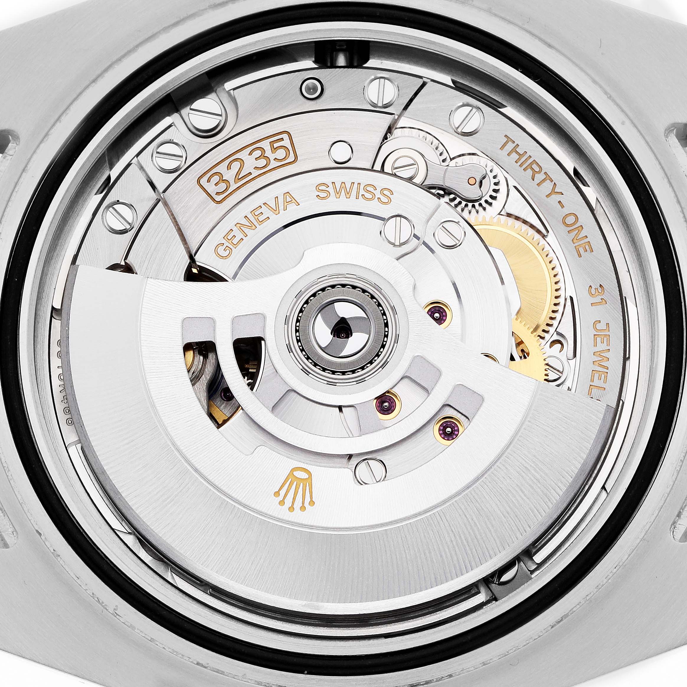 The image shows the movement mechanism of a Rolex Submariner, model 126610, focusing on the intricate components and engraving details.