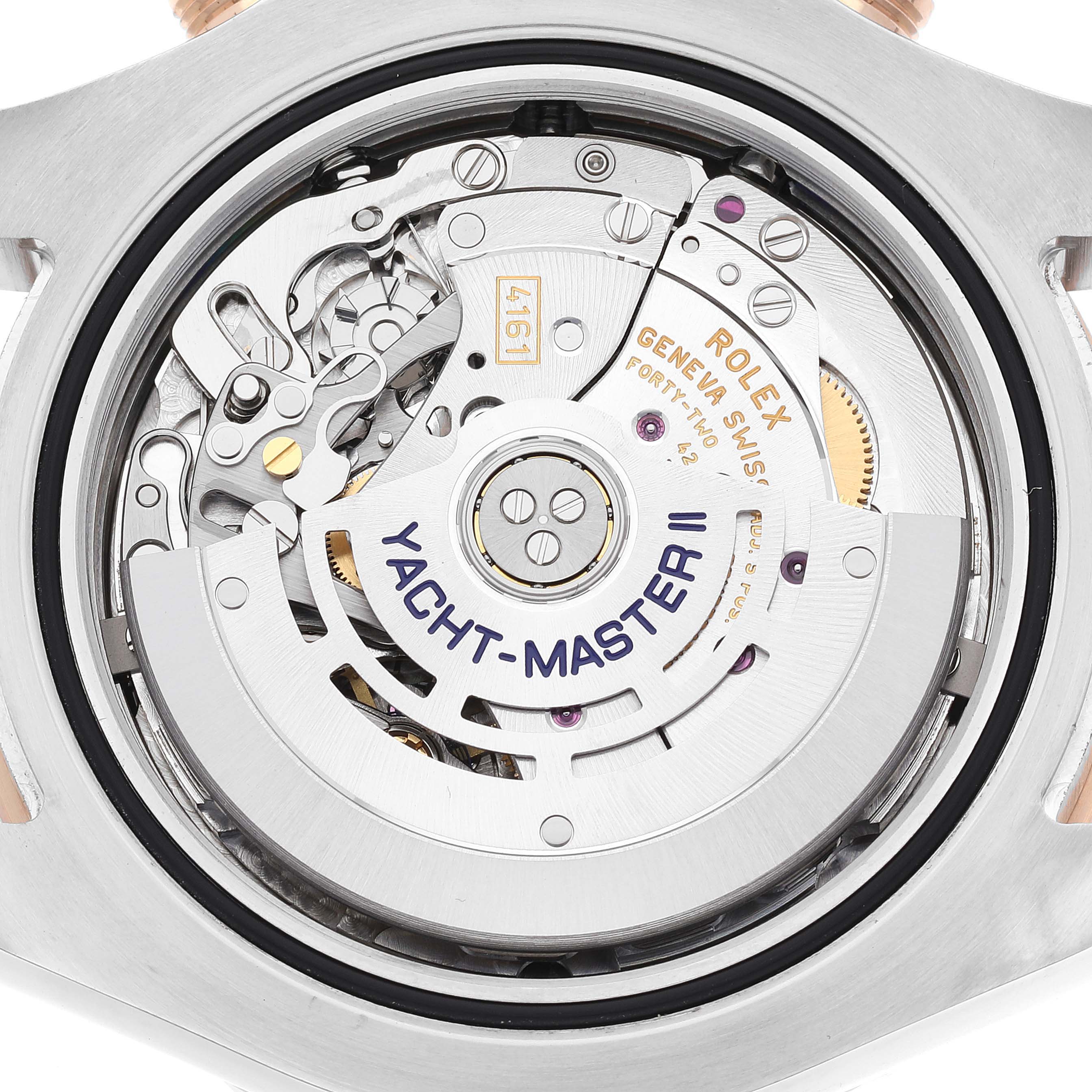 This image shows the movement and internal mechanics of a Rolex Yacht-Master 116681 Men
s Steel and Gold (two tone) White Dial 116681 Men
s Steel and Gold (two tone) White Dial II watch from a back angle.
