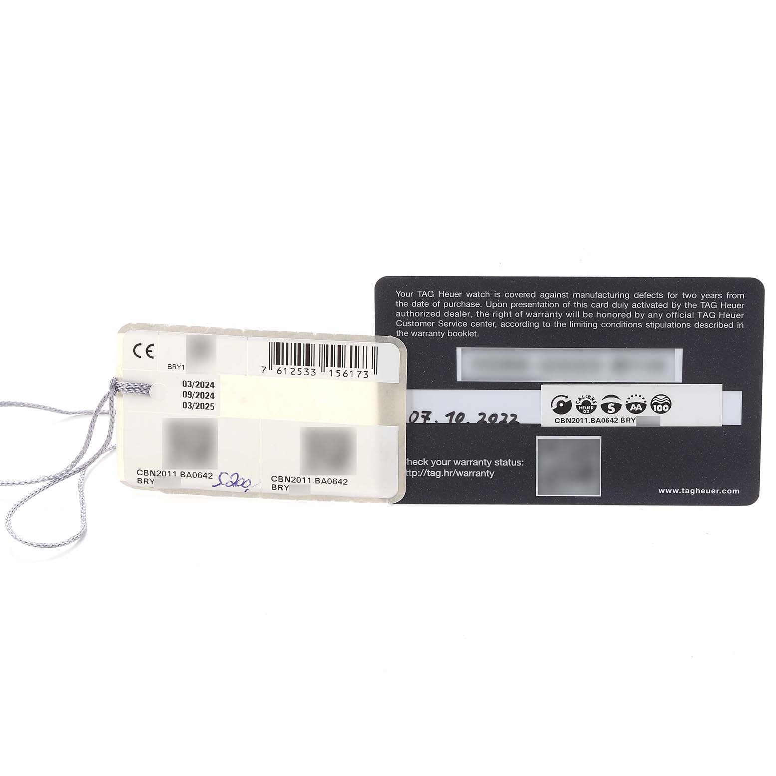 The image shows warranty cards and tags for a Tag Heuer Carrera CBN2011.BA0642 Men's Stainless Steel Blue Dial CBN2011.BA0642 Men's Stainless Steel Blue Dial watch model CBN2011.BA0642.