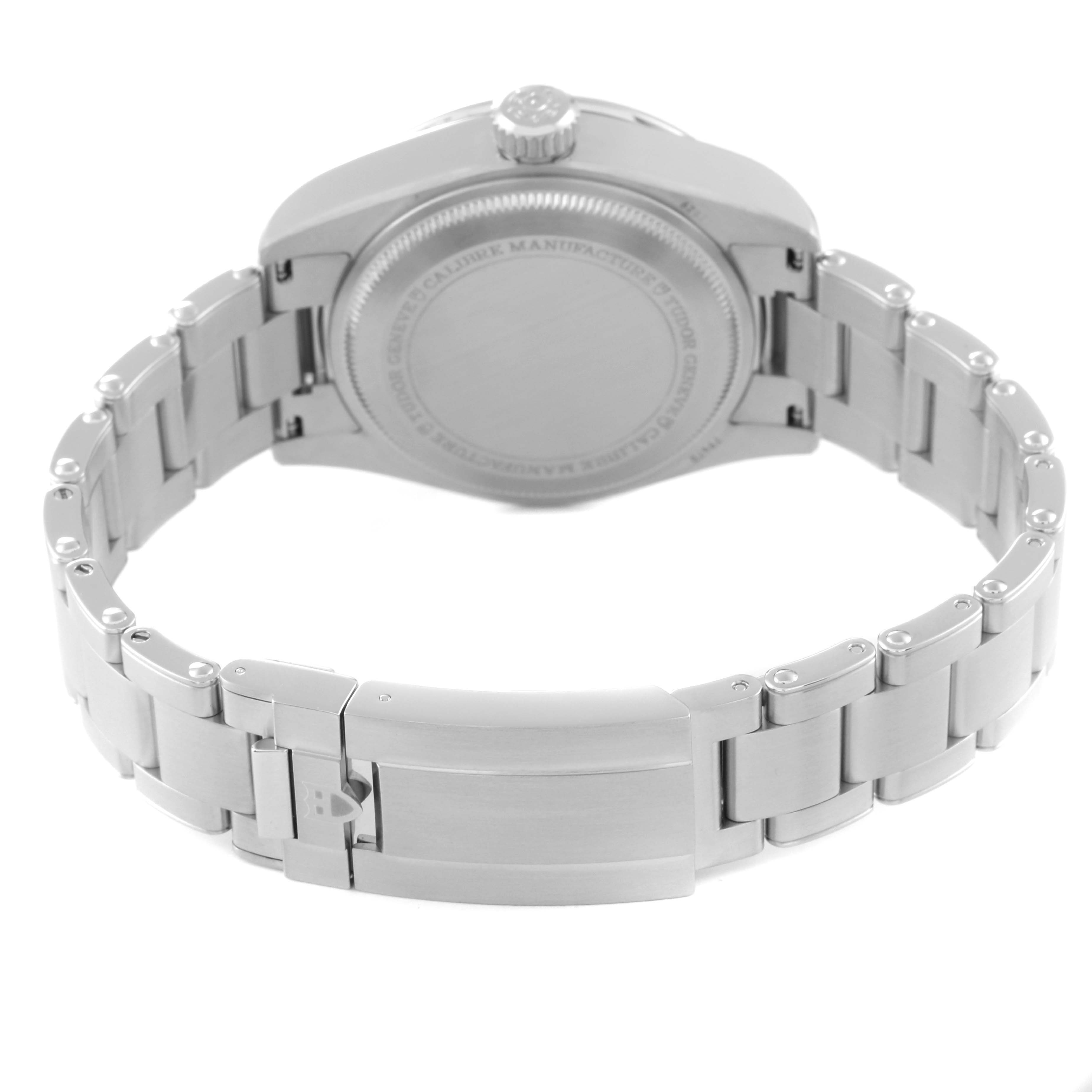 The image shows the back view of the Tudor Heritage Black Bay M79470-0003 Men's Stainless Steel Black Dial M79470-0003 Men's Stainless Steel Black Dial watch, highlighting the case back and stainless steel bracelet with a closed clasp.