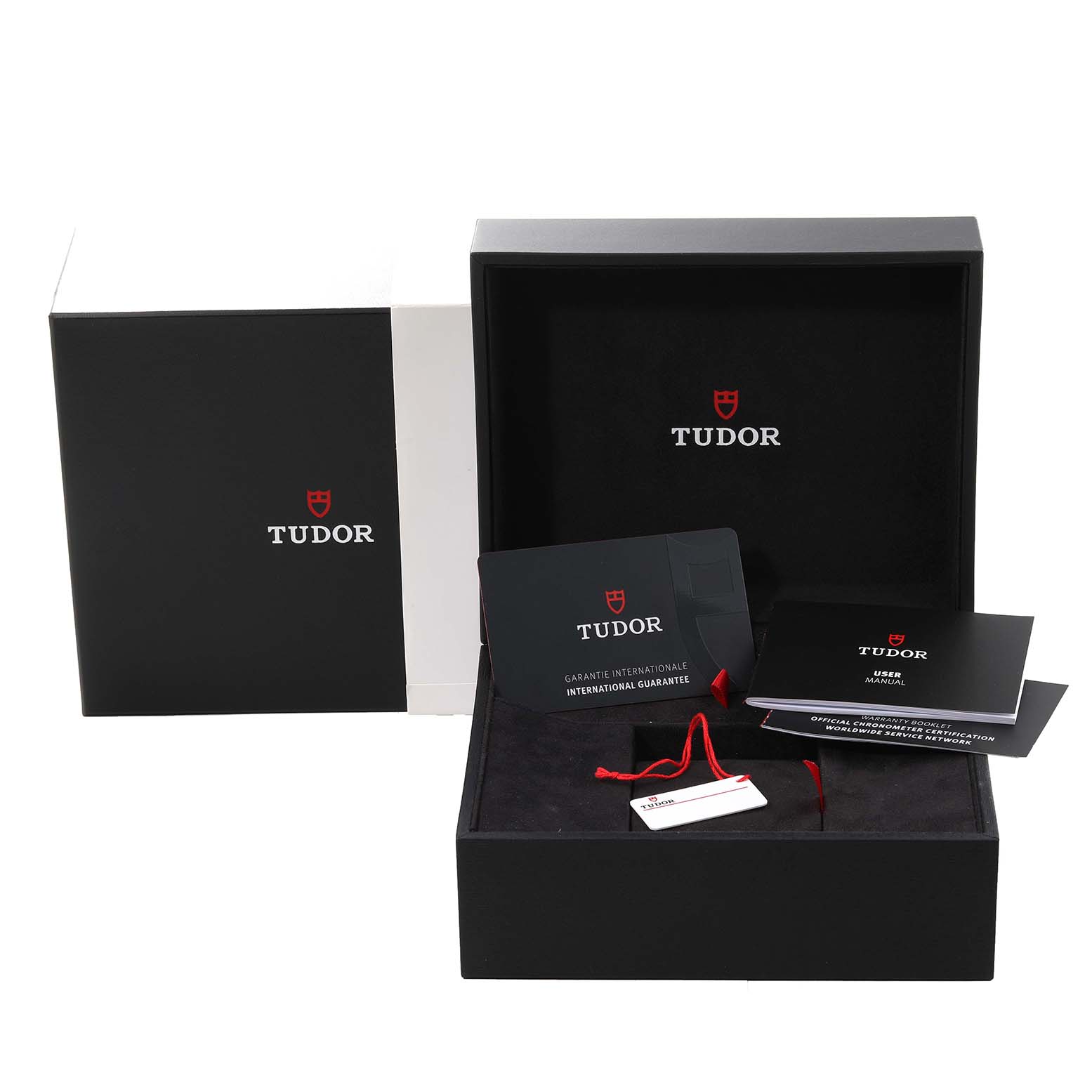 The image shows the Tudor Heritage Black Bay M79470-0003 Men's Stainless Steel Black Dial M79470-0003 Men's Stainless Steel Black Dial watch packaging with the box, guarantee card, user manual, and tags.