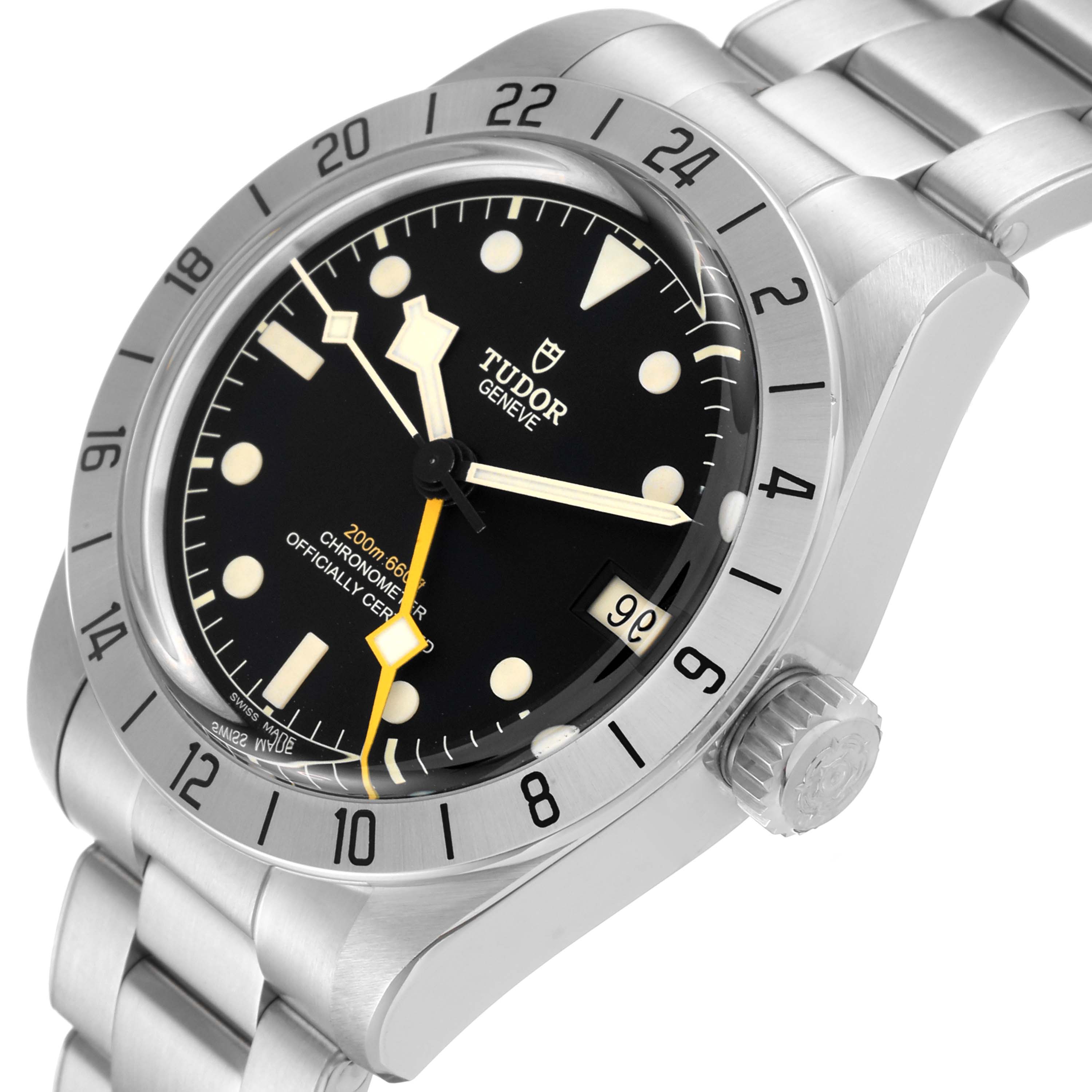This image shows a Heritage Black Bay model by Tudor from a three-quarter angle, highlighting the dial, bezel, crown, and part of the bracelet.