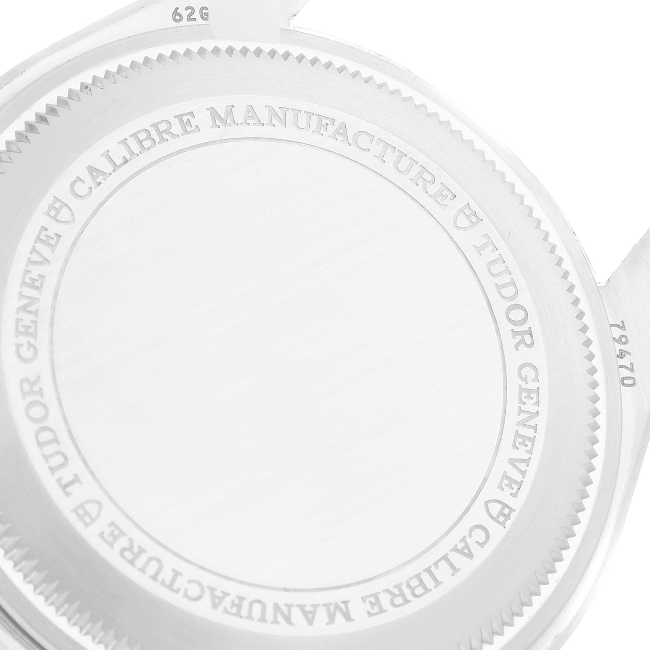 The image shows the back case of a Tudor Heritage Black Bay M79470-0003 Men's Stainless Steel Black Dial M79470-0003 Men's Stainless Steel Black Dial watch, displaying brand engravings and model number 79470.