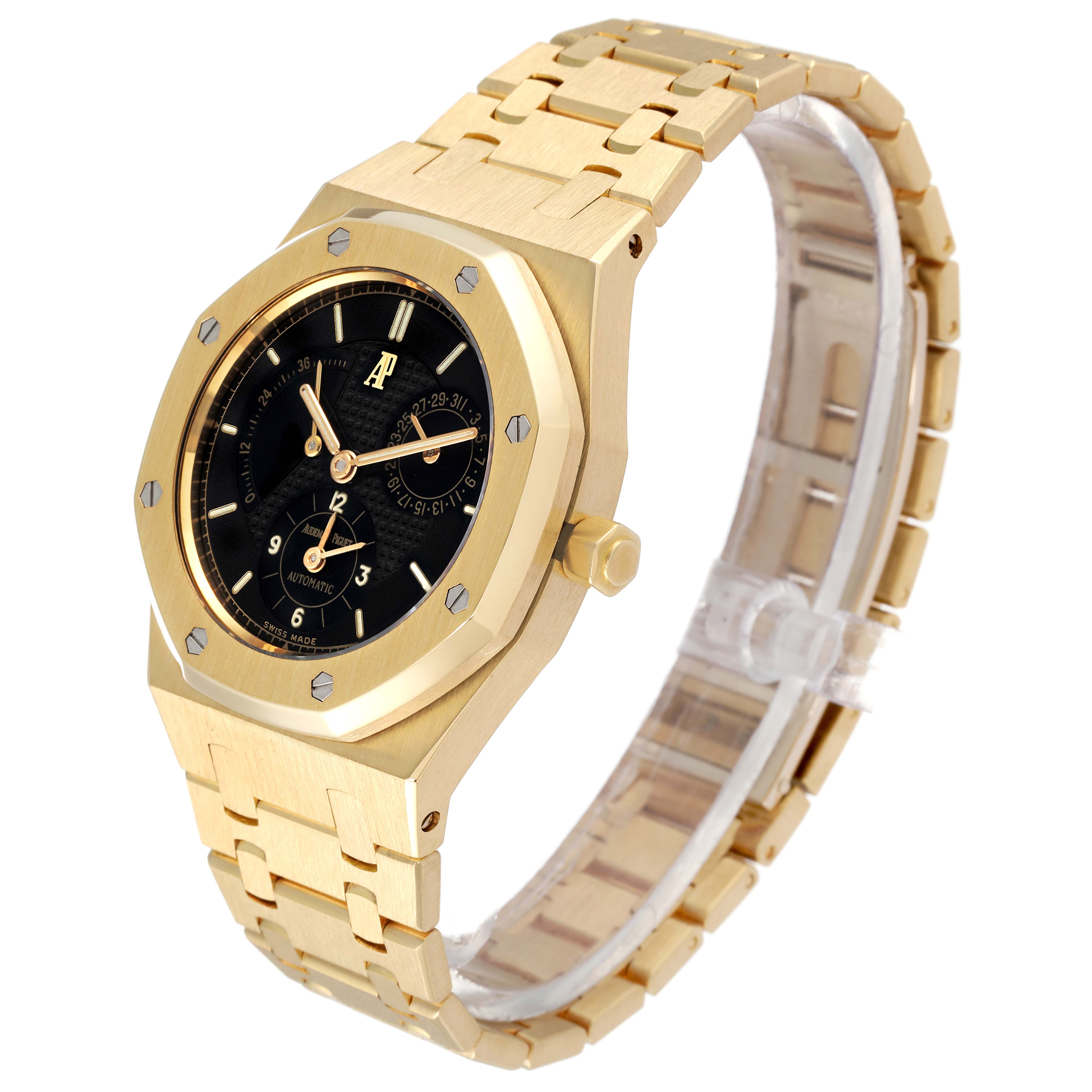 The image shows a side and top angle of the Audemars Piguet Royal Oak 25730BA Men's Yellow Gold Black Dial 25730BA Men's Yellow Gold Black Dial watch, highlighting its gold case, black dial, and bracelet.