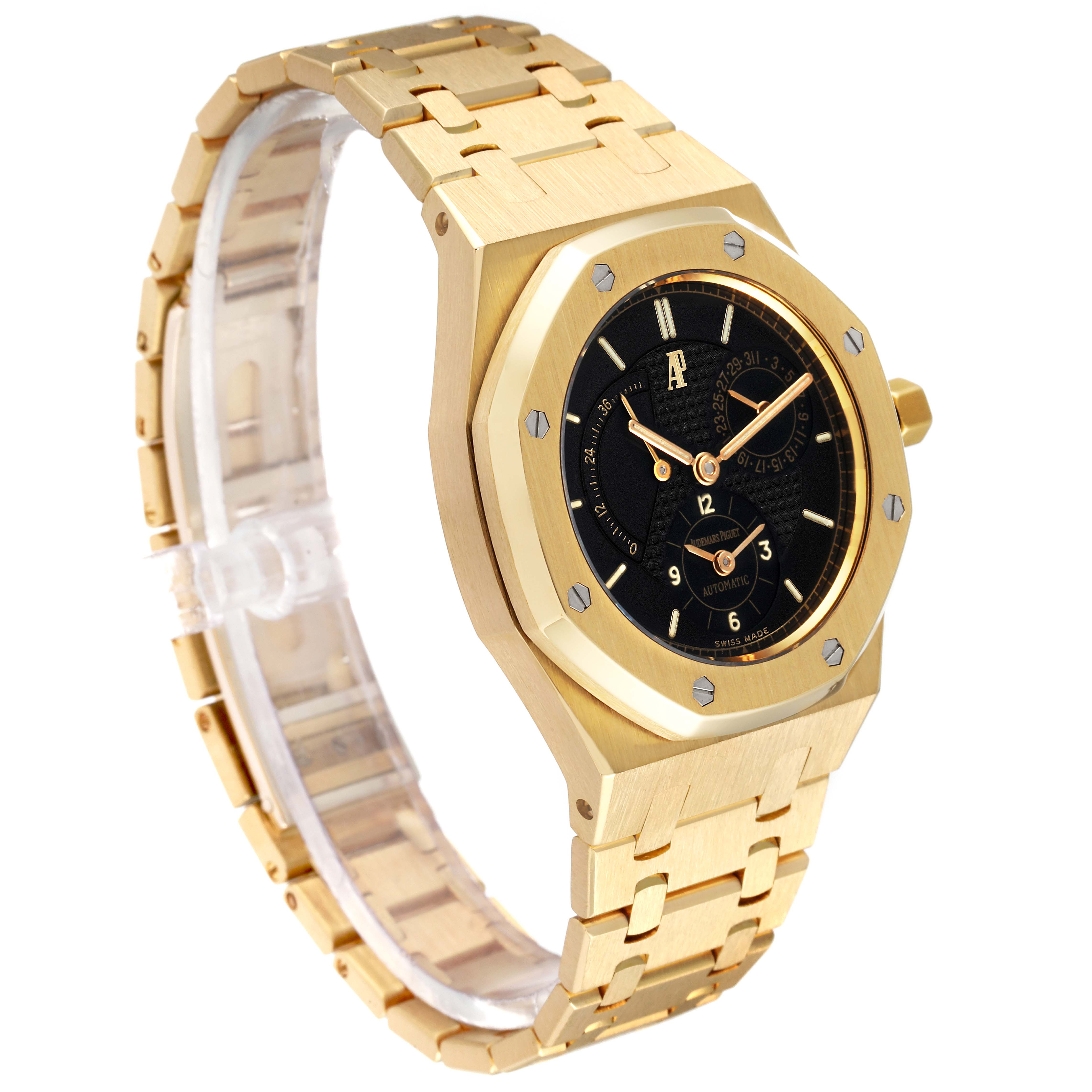 The image shows an Audemars Piguet Royal Oak 25730BA Men's Yellow Gold Black Dial 25730BA Men's Yellow Gold Black Dial watch at a slight side angle, highlighting its gold case, bezel, black dial, and gold bracelet.