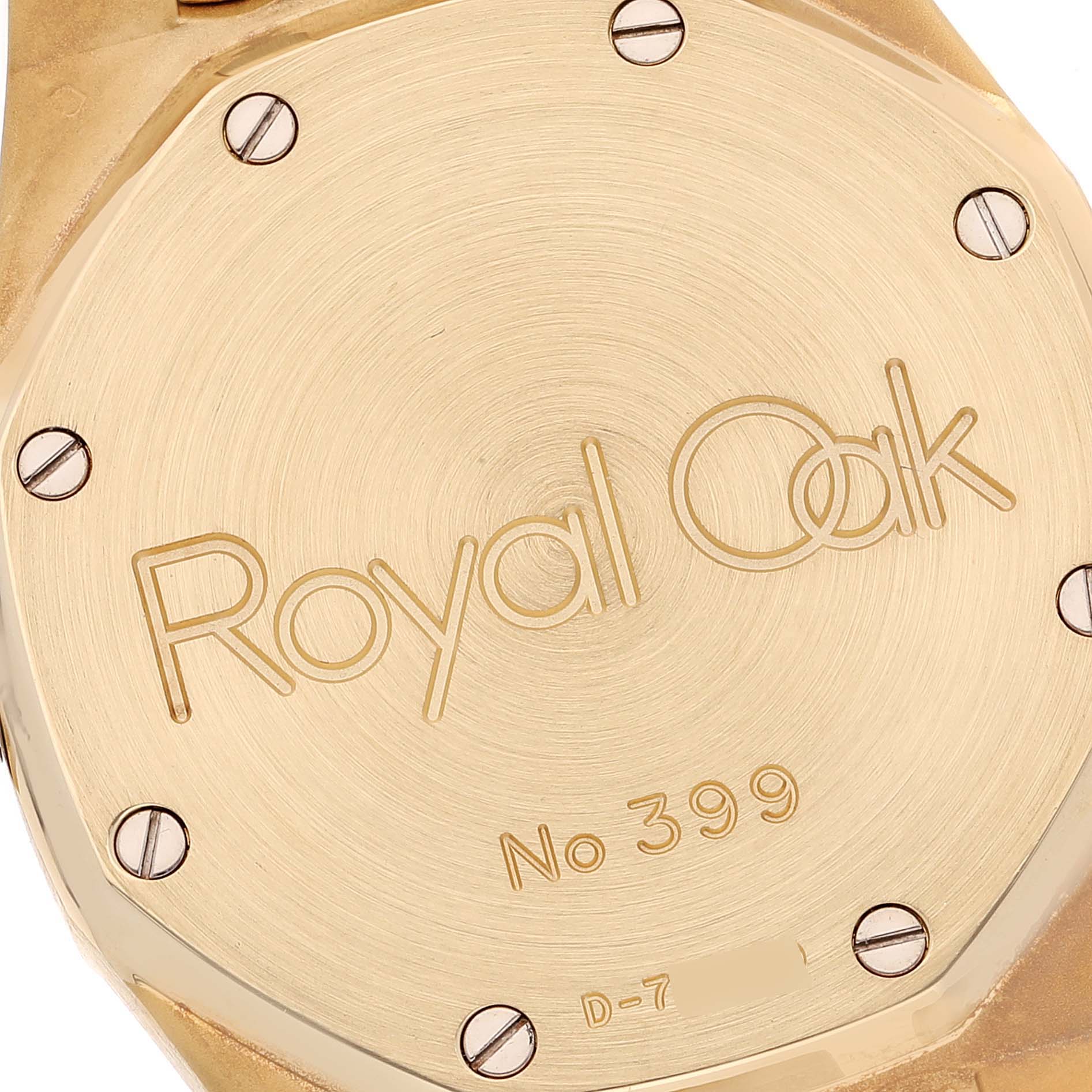 This image shows the backside of the Audemars Piguet Royal Oak 25730BA Men's Yellow Gold Black Dial 25730BA Men's Yellow Gold Black Dial watch, displaying its identification and screws.