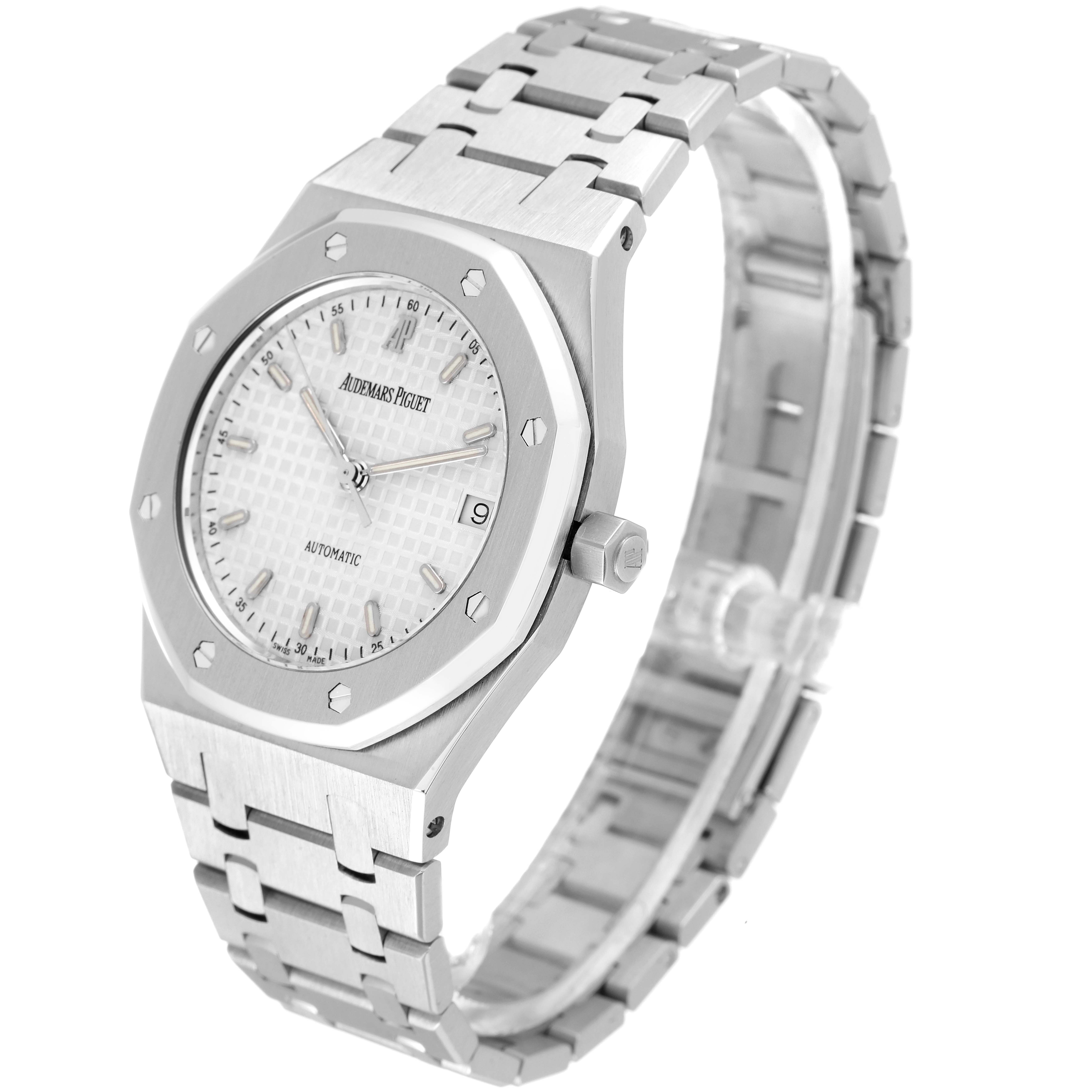 The image shows a Royal Oak model by Audemars Piguet at a three-quarter angle, displaying the dial, bezel, crown, and bracelet.