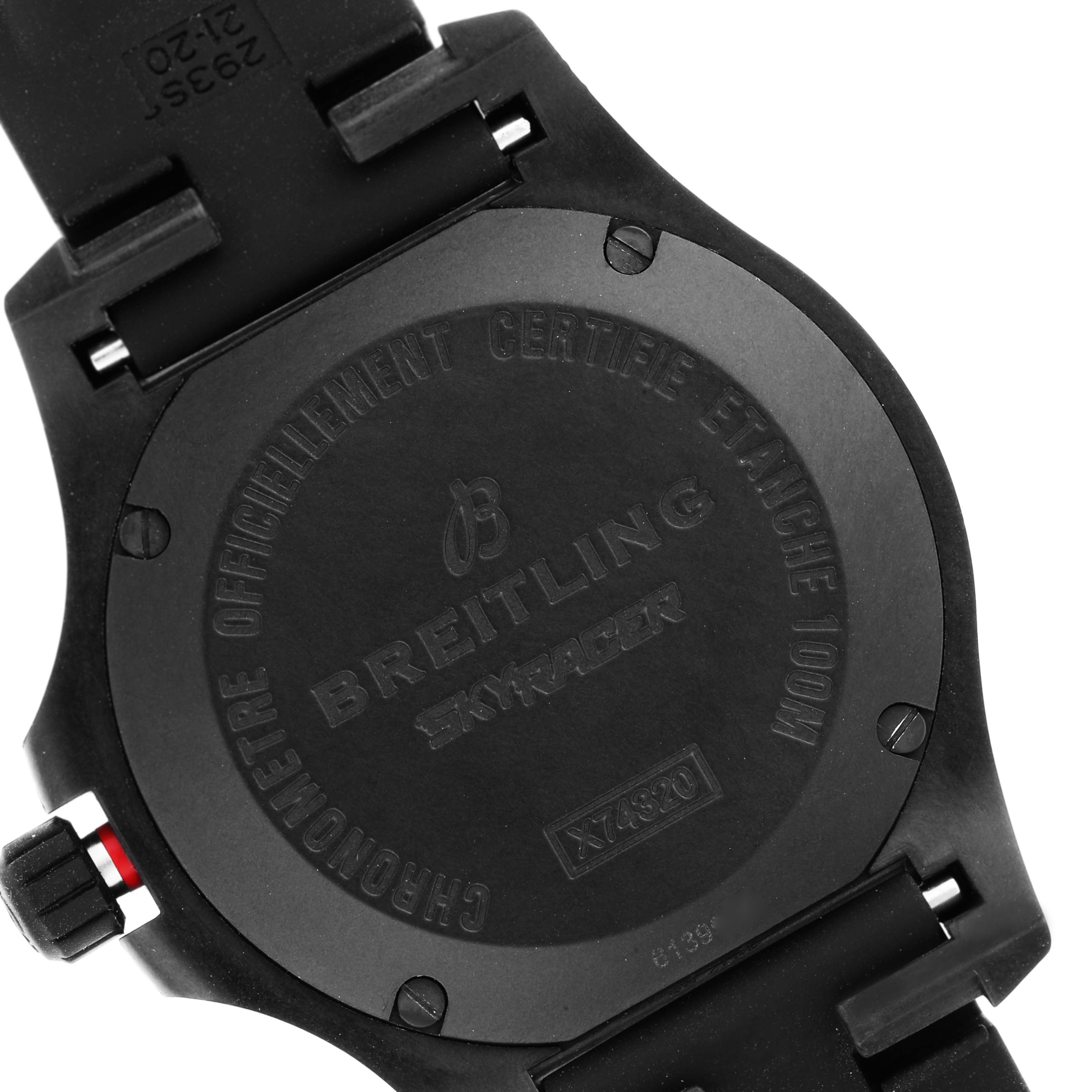 A rear angle showing the case back of a Colt model Breitling watch, featuring engravings and parts of the strap.