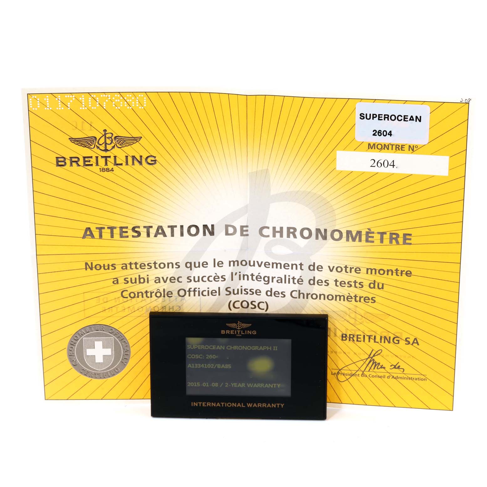 The image shows a Breitling Superocean A13341 Men's Stainless Steel Black Dial A13341 Men's Stainless Steel Black Dial watch's chronometer certificate and international warranty card.