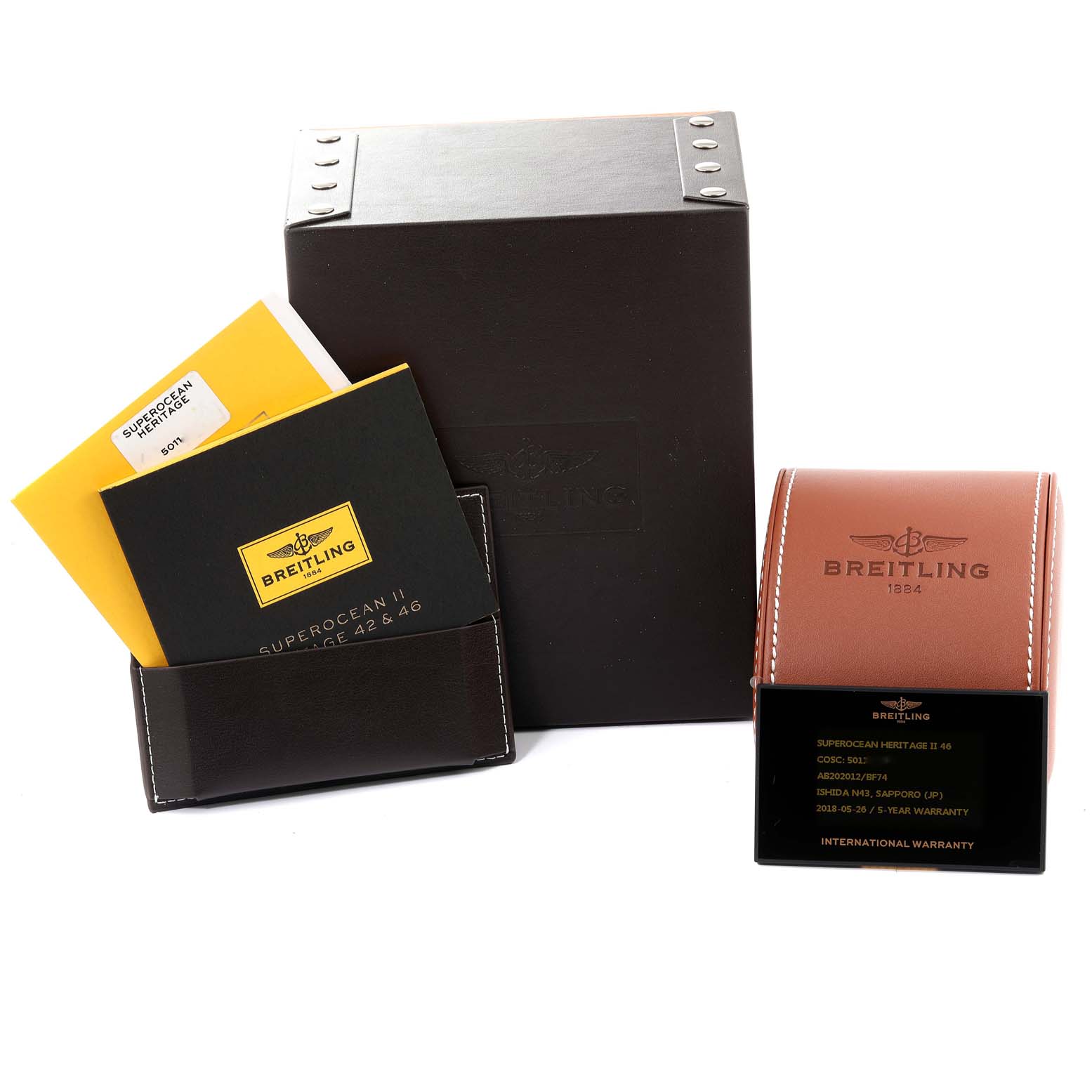 The image shows Breitling Superocean AB202016-C961-152A Men
s Stainless Steel Black Dial AB202016-C961-152A Men
s Stainless Steel Black Dial watch accessories, including boxes, a leather pouch, manuals, and a warranty card.