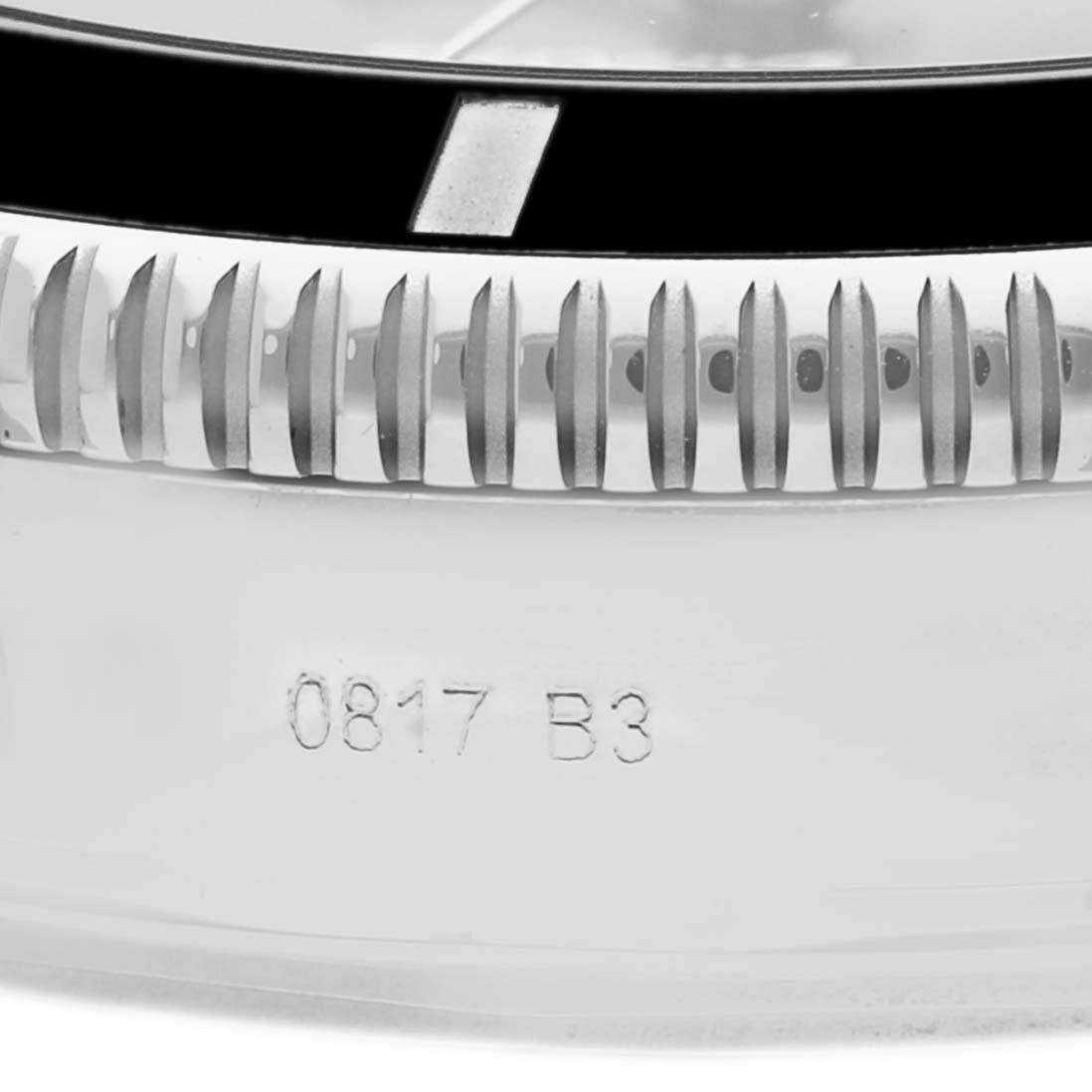 The image shows a close-up of the bezel and part of the case back of a Breitling Superocean AB2010161C1A1 Men
s Stainless Steel Black Dial AB2010161C1A1 Men
s Stainless Steel Black Dial watch with engraved numbers "0817 B3."