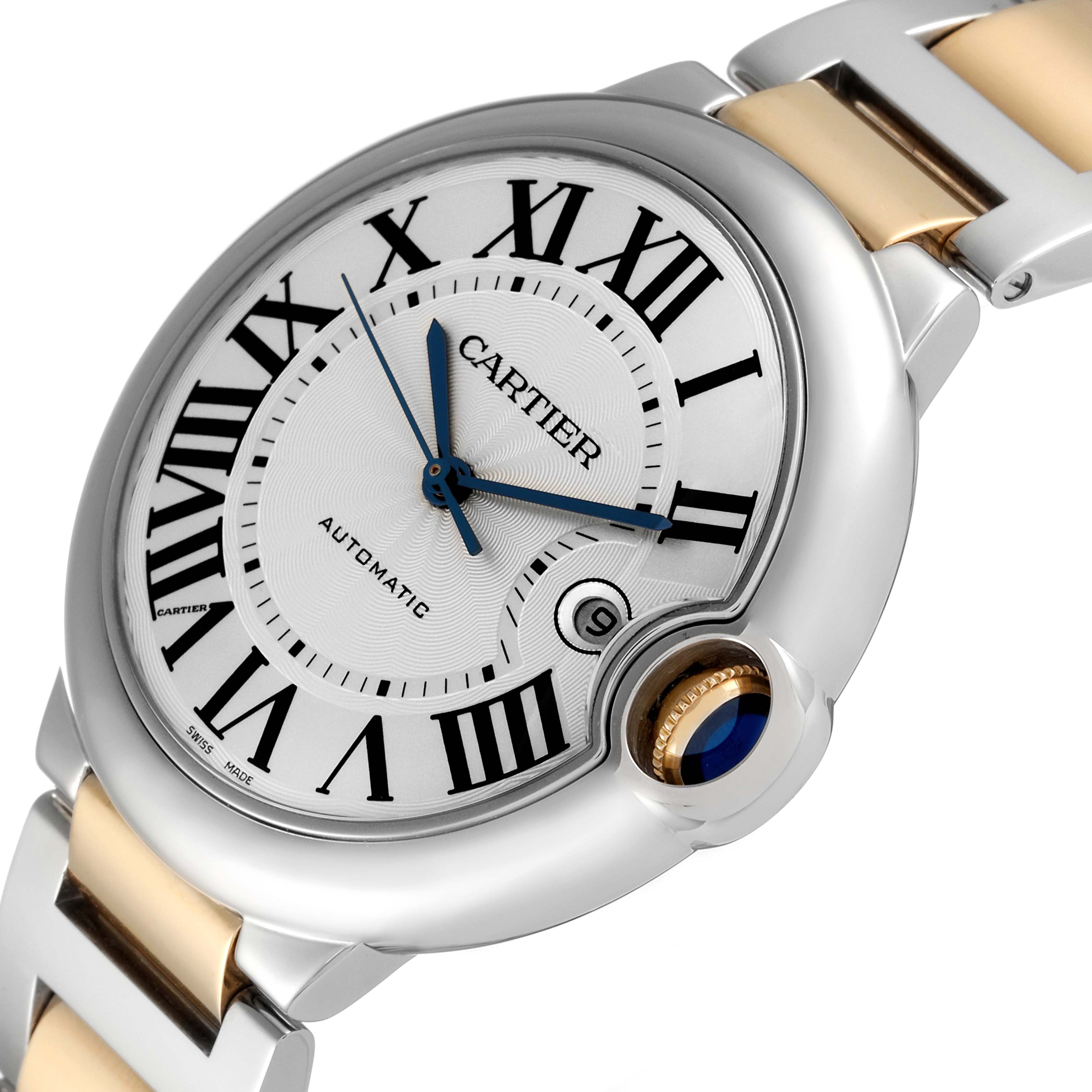 The image shows a close-up of a Ballon Bleu de Cartier watch face at an oblique angle, highlighting the crown and bracelet.