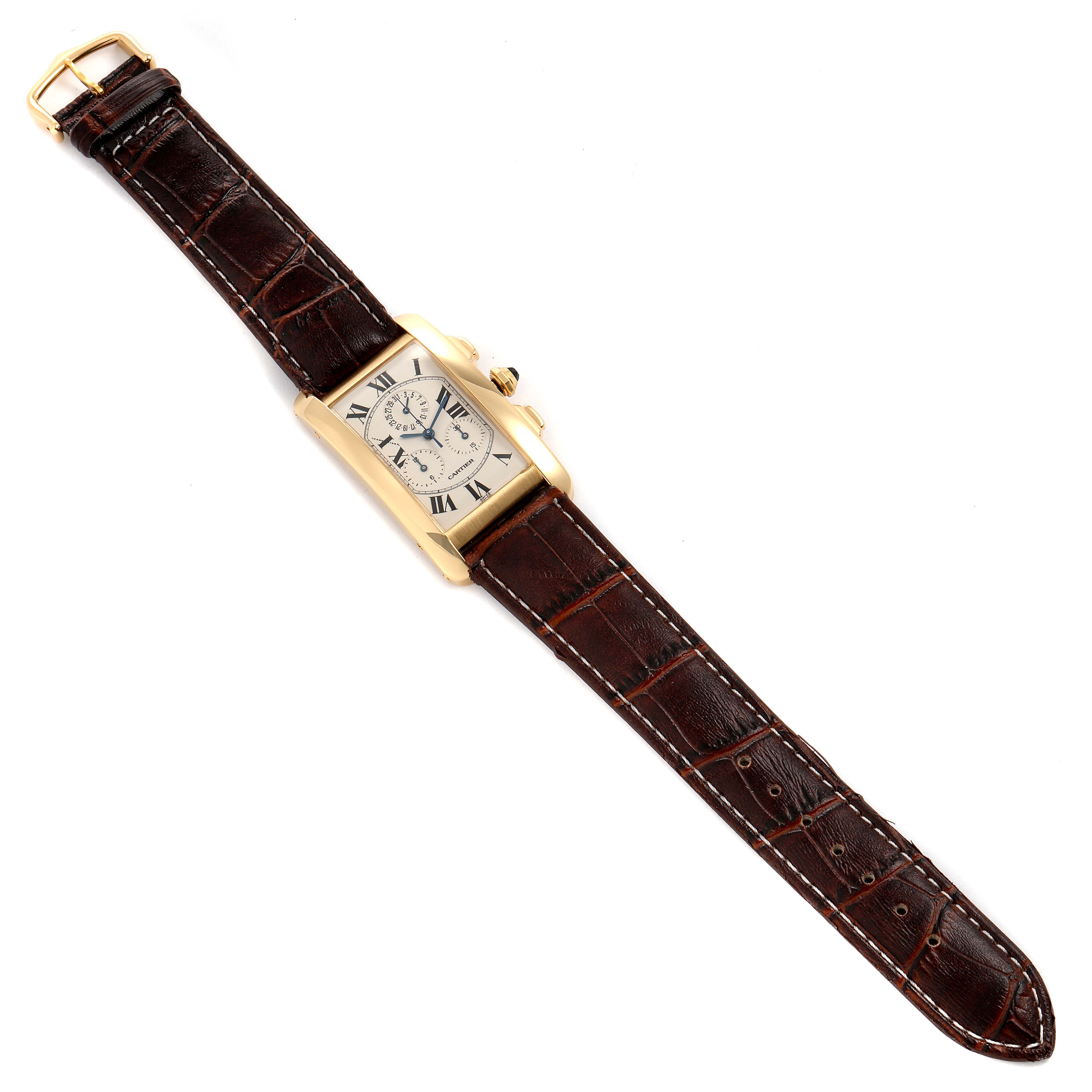 The image shows a top-down view of a Cartier Tank Americaine W2601156 Men's Yellow Gold Silver Dial W2601156 Men's Yellow Gold Silver Dial watch with a brown leather strap and rectangular dial.