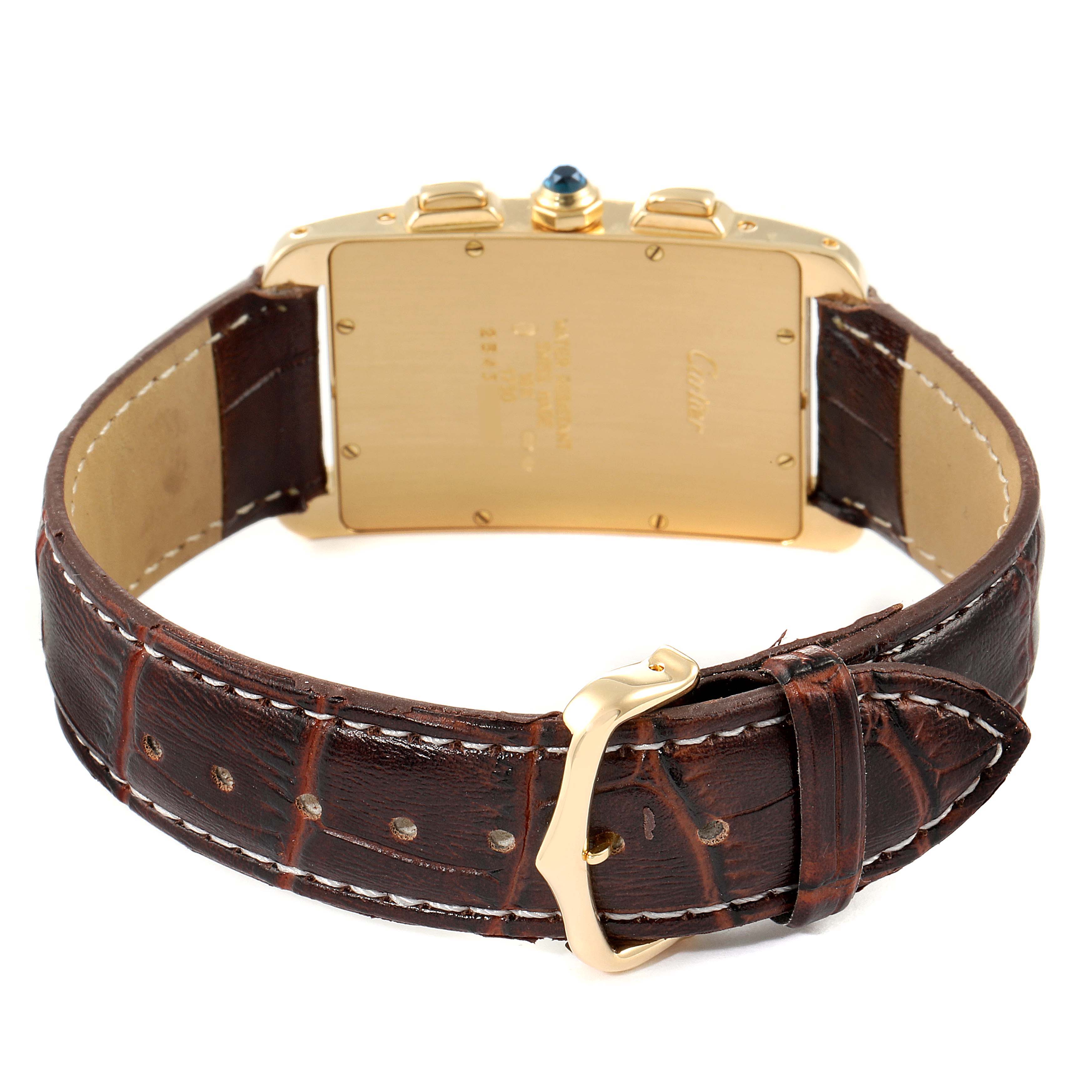 The image shows the back and strap of the Cartier Tank Americaine W2601156 Men's Yellow Gold Silver Dial W2601156 Men's Yellow Gold Silver Dial watch, highlighting the gold case and brown leather band.