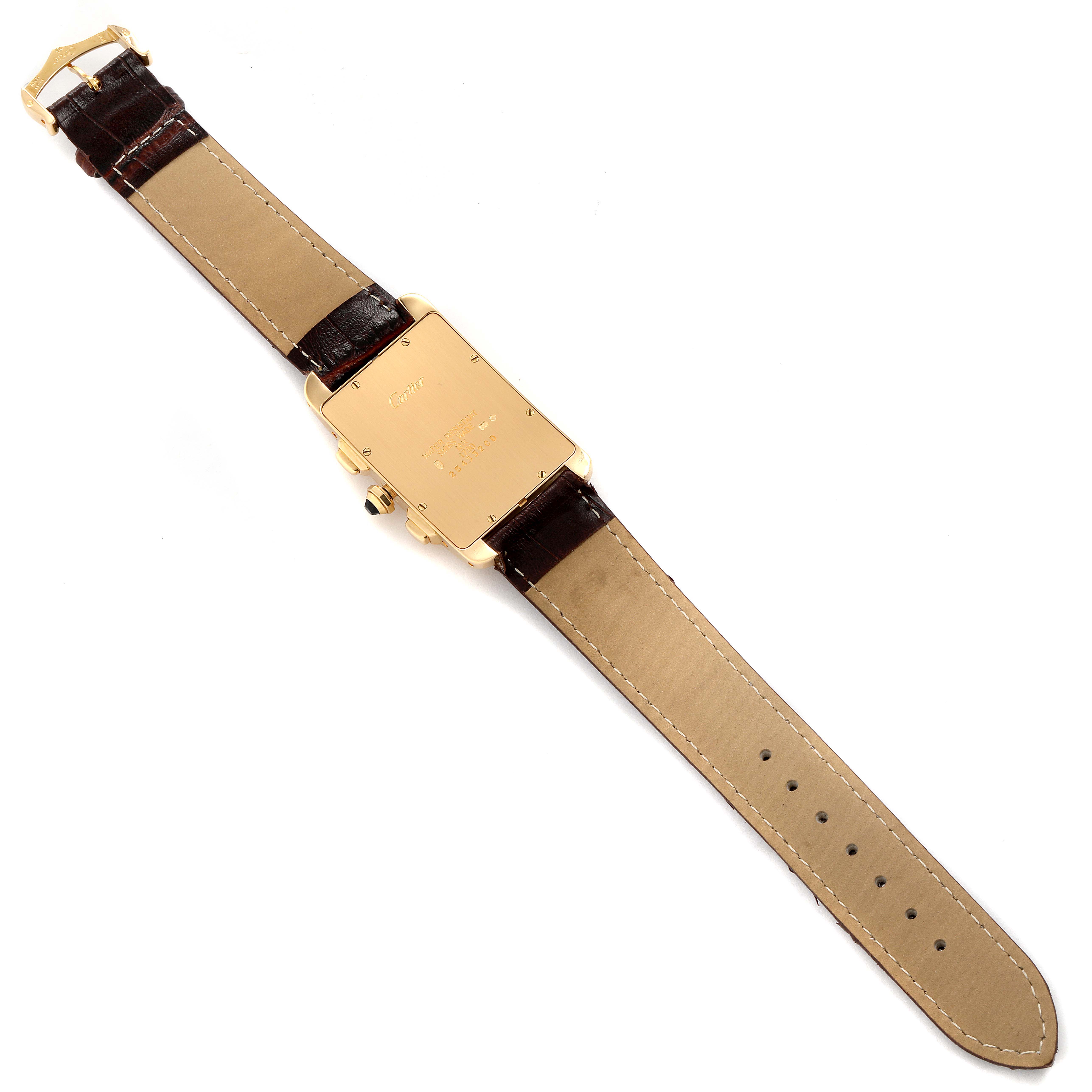 The image shows the backside of the Cartier Tank Americaine W2601156 Men's Yellow Gold Silver Dial W2601156 Men's Yellow Gold Silver Dial watch laid flat, revealing the strap and case back.