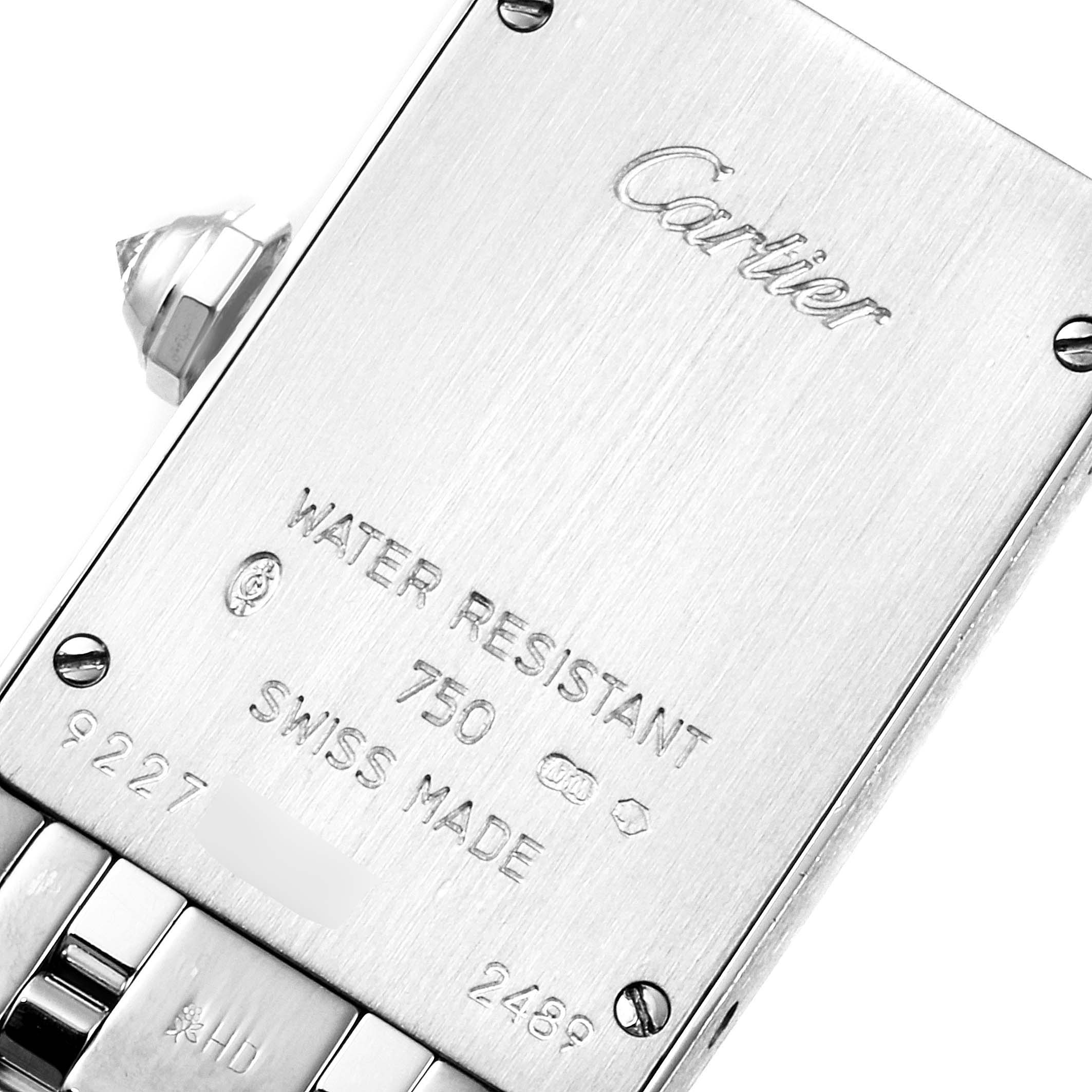 This image shows the engraved case back of the Cartier Tank Américaine watch including the crown and links of the bracelet.