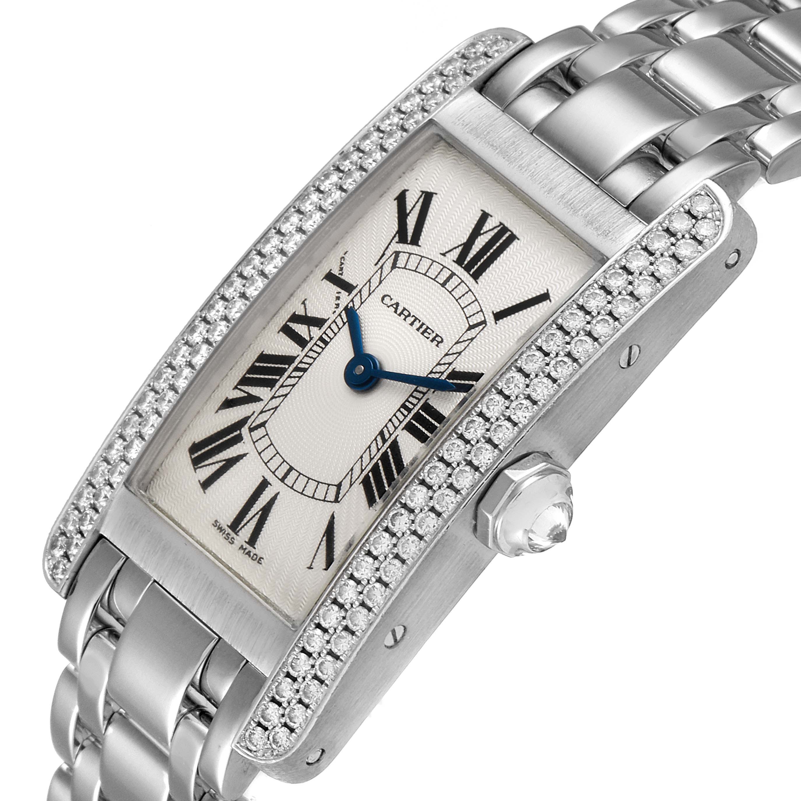 The image shows a tilted view of the Cartier Tank Americaine WB7018L1 Women
s White Gold Silver Dial WB7018L1 Women
s White Gold Silver Dial watch, featuring its face, bezel, crown, and bracelet.