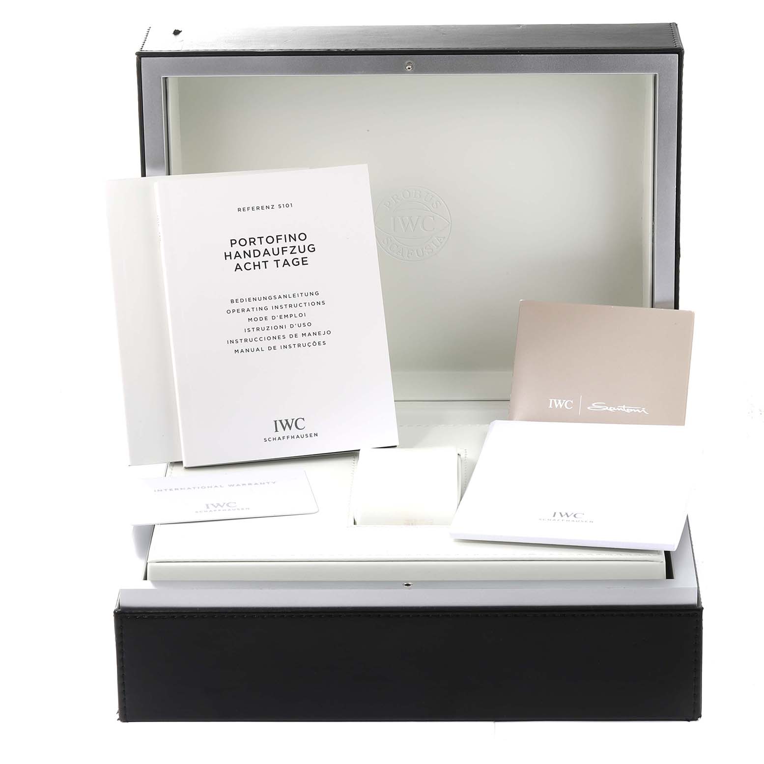 The image shows the packaging, manuals, and documentation for the IWC Portofino IW510103 Men's Stainless Steel Silver Dial IW510103 Men's Stainless Steel Silver Dial model.