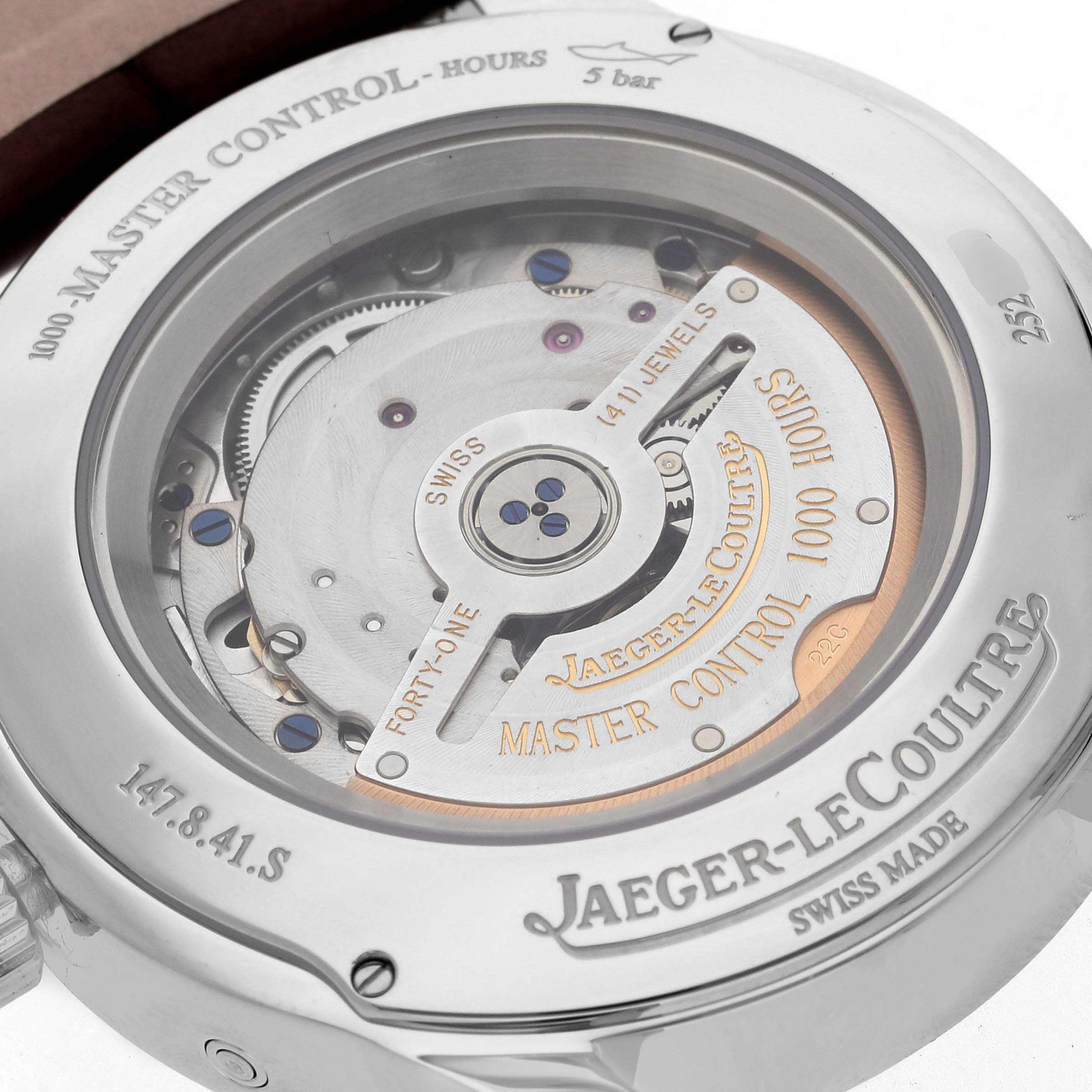 The image shows the back view of a Jaeger-LeCoultre Master Control watch, highlighting its automatic movement and mechanisms.