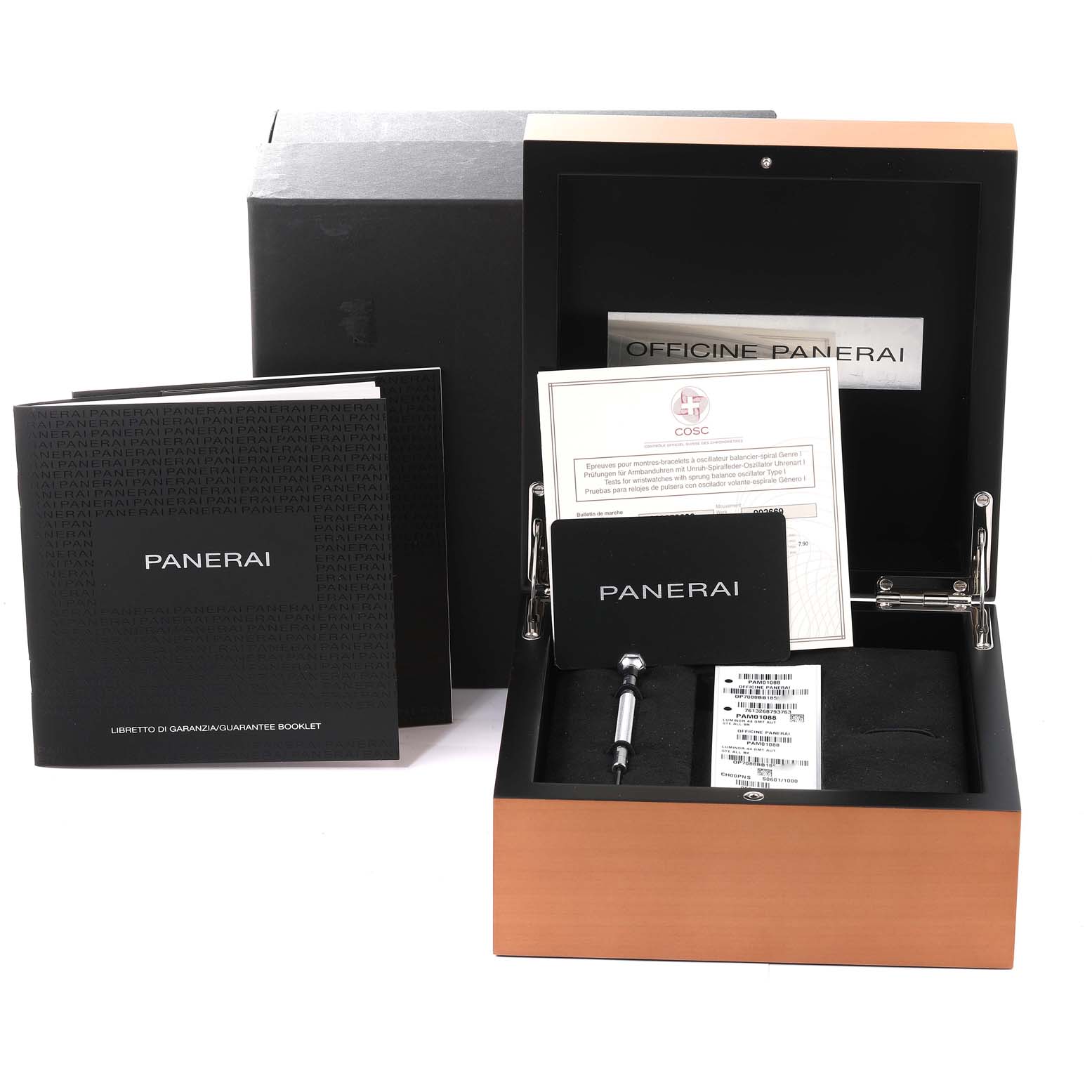 This image shows a Panerai Luminor PAM01088 Men
s Stainless Steel Black Dial PAM01088 Men
s Stainless Steel Black Dial packaging set with manuals, a certificate, and a toolkit at an angled top-down view.