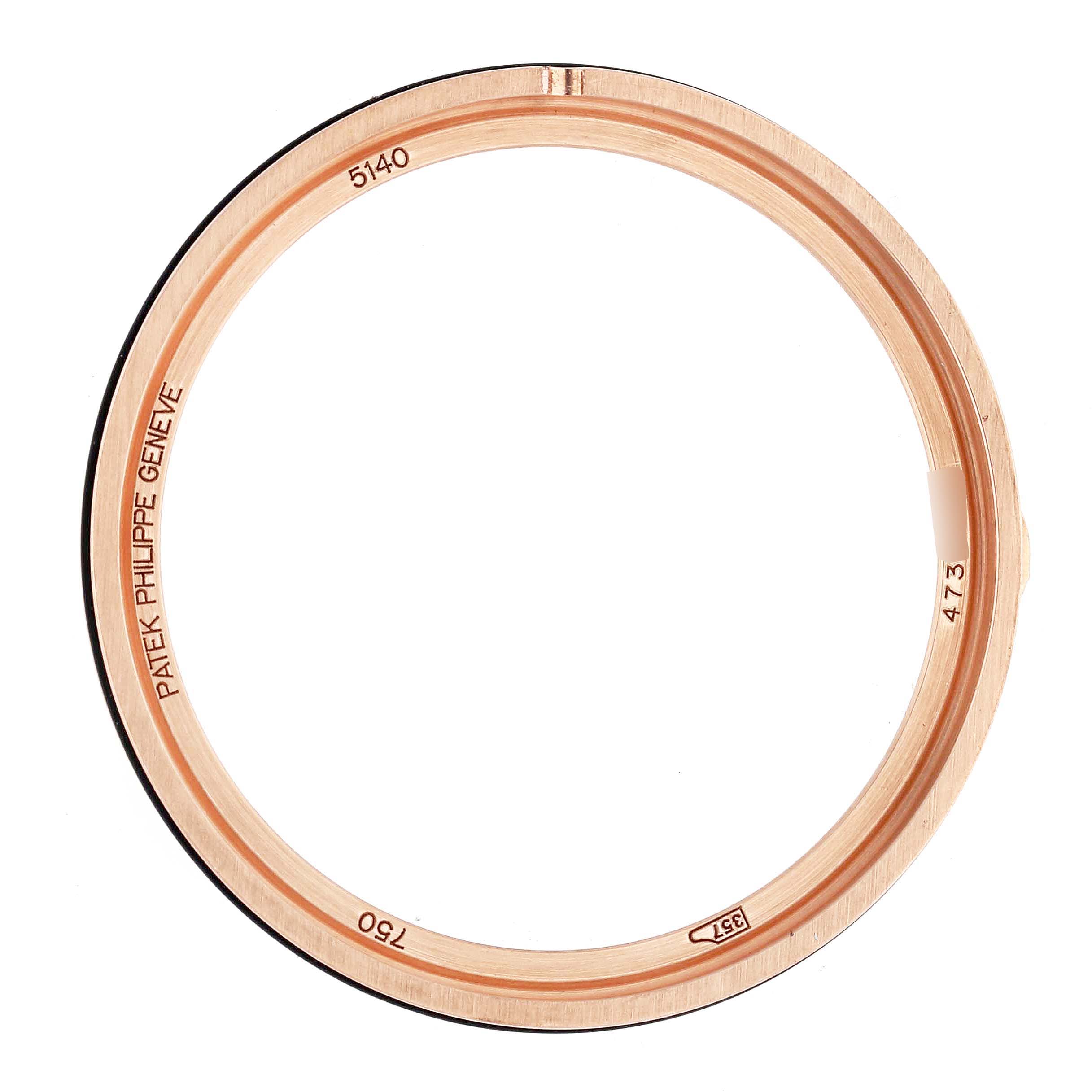 The image shows the bezel of a Patek Philippe Complications model 5140R-001, featuring engravings and viewed from the top angle.