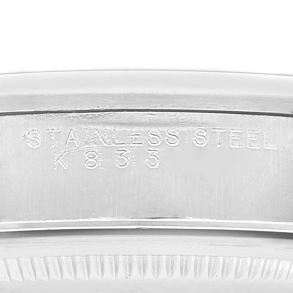 Close-up of the case back edge showing the "STAINLESS STEEL" engraving on the Rolex Air-King 14000 Men's Stainless Steel Blue Dial 14000 Men's Stainless Steel Blue Dial model.