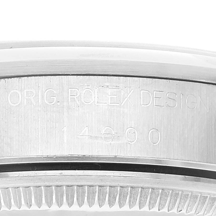 The image shows a close-up of the side case of a Rolex Air-King 14000 Men's Stainless Steel Blue Dial 14000 Men's Stainless Steel Blue Dial watch, featuring engraved text.