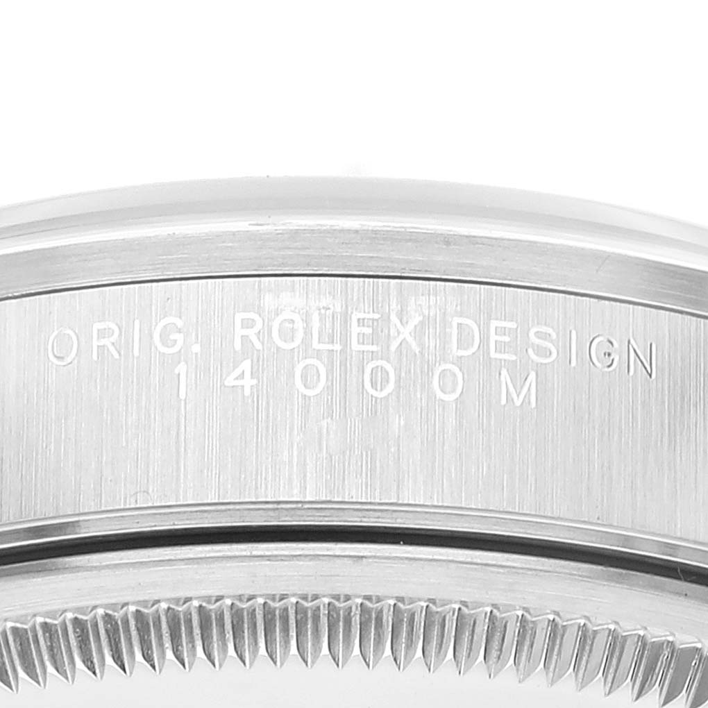 This image shows a close-up of the case side of the Rolex Air-King 14000 Men's Stainless Steel Black Dial 14000 Men's Stainless Steel Black Dial watch, featuring engravings and a portion of the bezel.