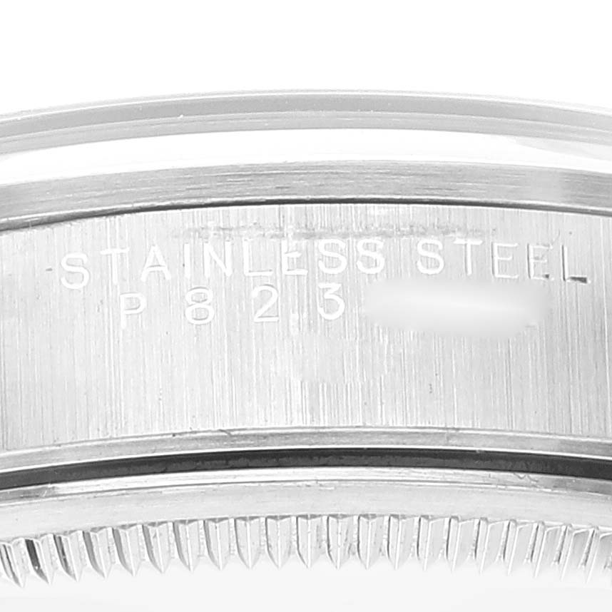 The image shows a close-up, side view of the case edge of a Rolex Air-King 14000M Men's Stainless Steel Black Dial 14000M Men's Stainless Steel Black Dial watch, highlighting the stainless steel markings.