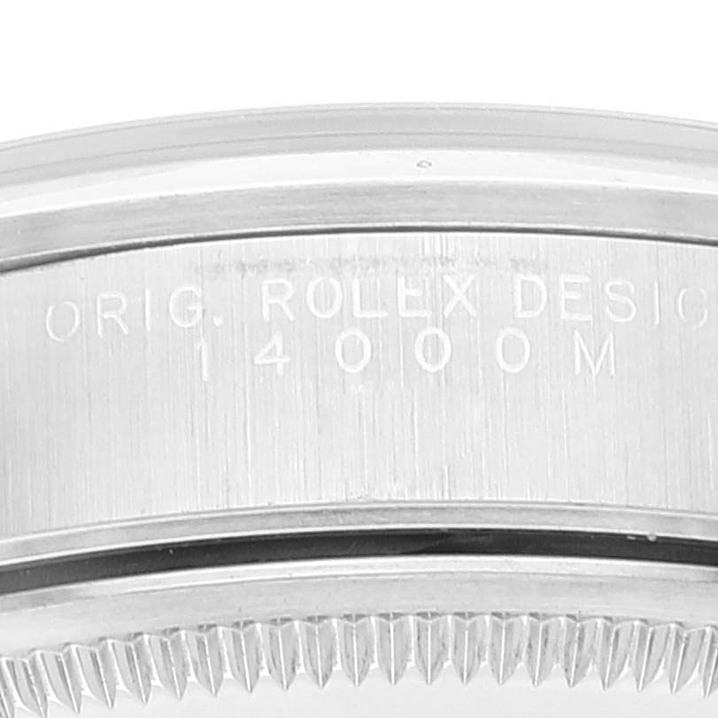 This close-up image shows the engraved side bezel and part of the knurled edge of a Rolex Air-King 14000M Men's Stainless Steel Black Dial 14000M Men's Stainless Steel Black Dial model.