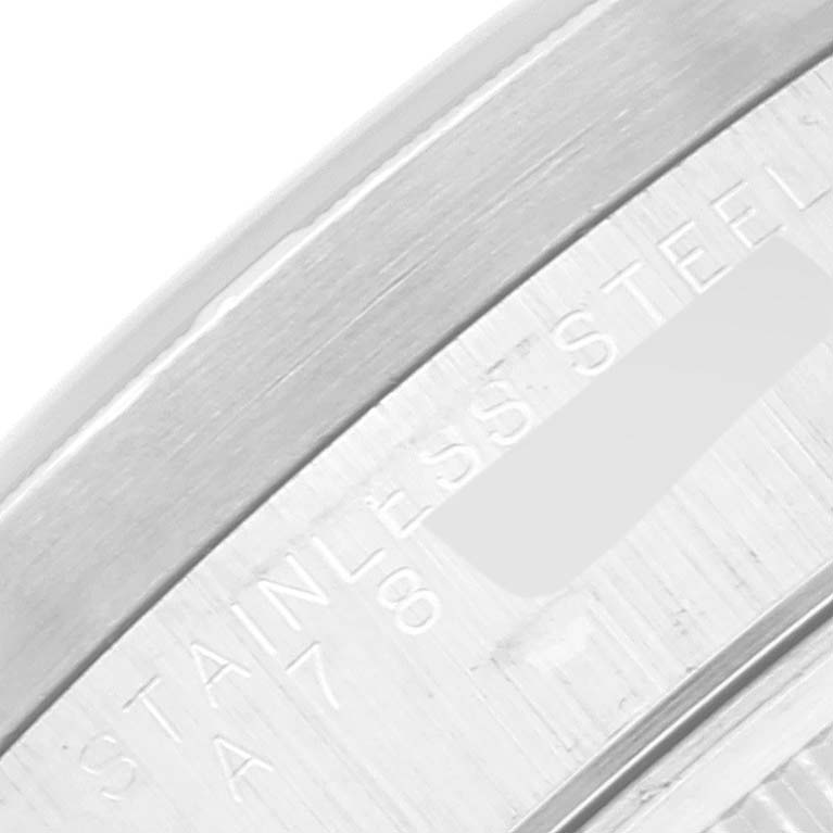 The image shows a close-up of the engraved case back of a Rolex Air-King 14010 Men's Stainless Steel Black Dial 14010 Men's Stainless Steel Black Dial watch, highlighting the "STAINLESS STEEL" engraving.
