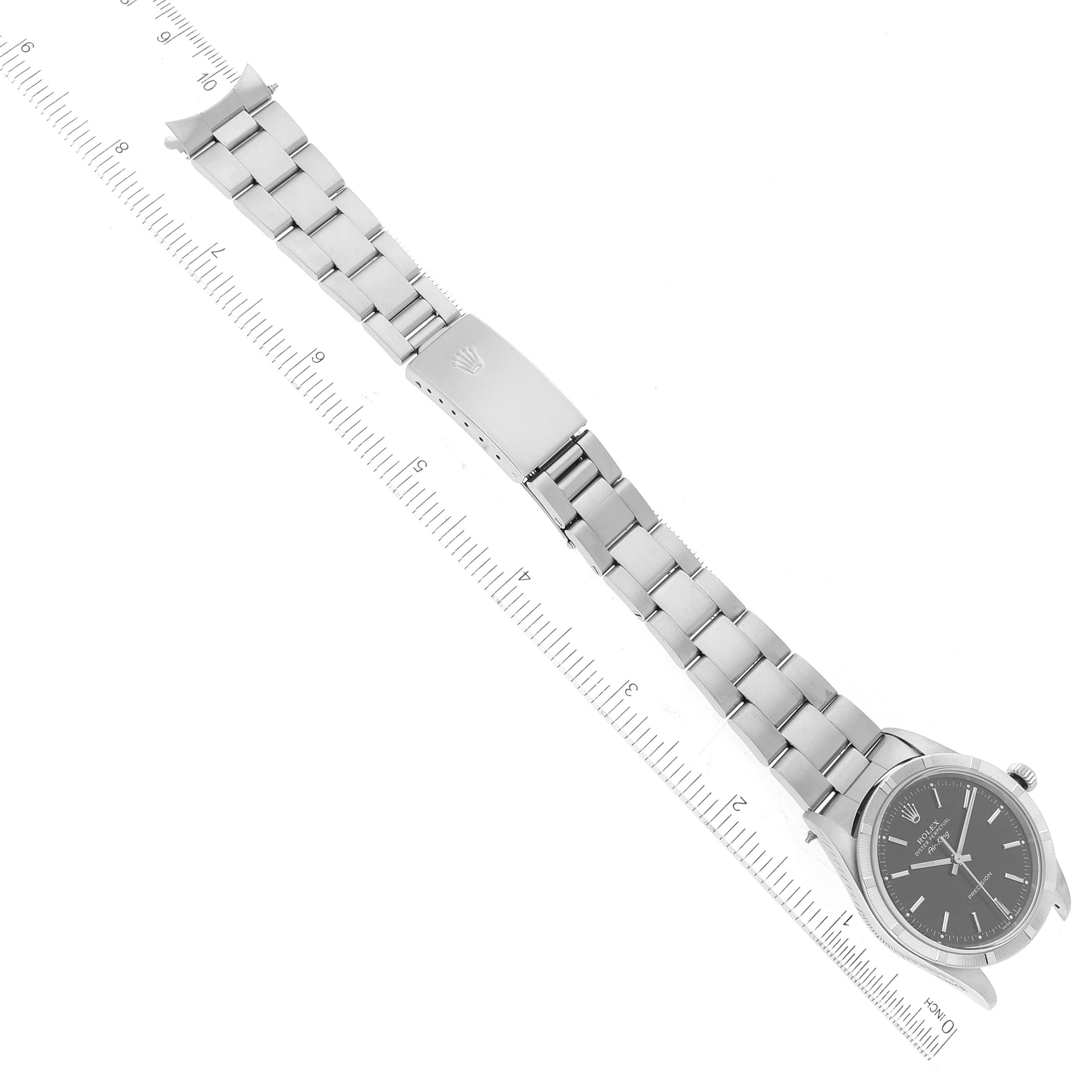 The image shows a top-down view of a Rolex Air-King 14010 Men's Stainless Steel Black Dial 14010 Men's Stainless Steel Black Dial watch, displaying the bracelet and clasp alongside a ruler.