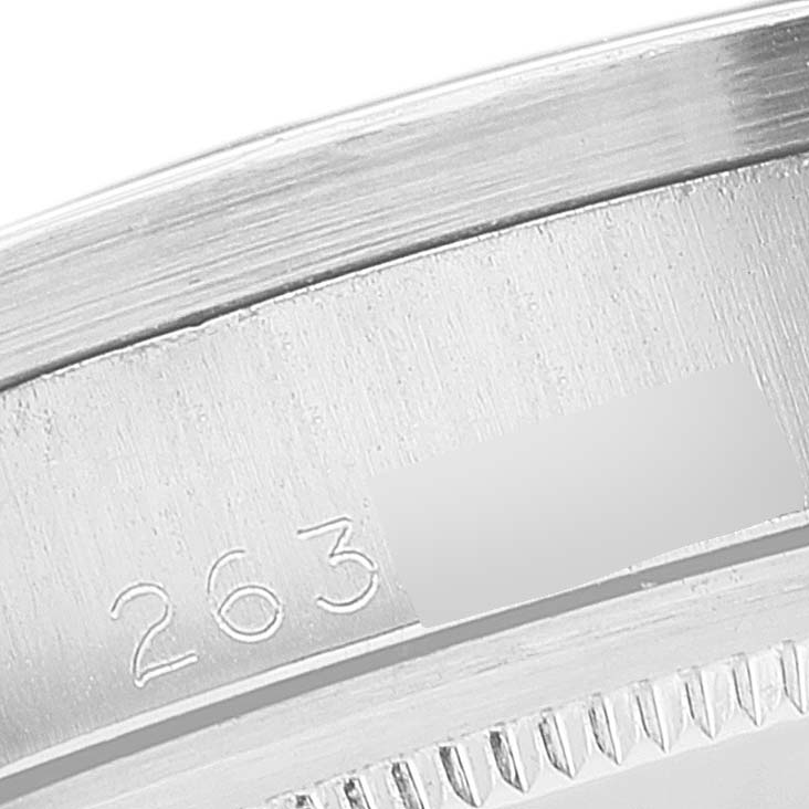 This image shows a close-up angle of the engraved serial or model number on the case of the Rolex Vintage Collection 1501 Men's Stainless Steel Silver Dial 1501 Men's Stainless Steel Silver Dial watch.
