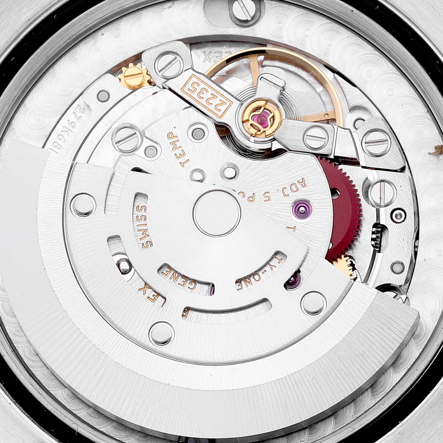 This image shows the intricate internal mechanics of a Rolex Mid-Size 178341 Women's Steel and Gold (two tone) Brown Dial 178341 Women's Steel and Gold (two tone) Brown Dial model watch, featuring gears and the self-winding rotor.