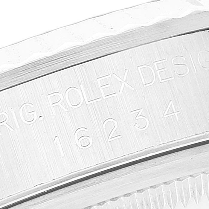 This image shows a close-up of the engraving on the case rehaut of a Rolex Datejust 16234 Men's Stainless Steel Black Dial 16234 Men's Stainless Steel Black Dial watch, specifically model 16234.
